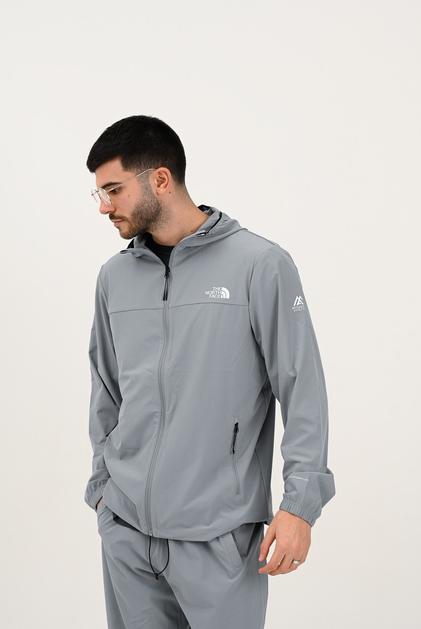 THE NORTH FACE Giacca a vento Mountain Athletics grigia da uomo NF0A8BP1H5F1 . THE NORTH FACE