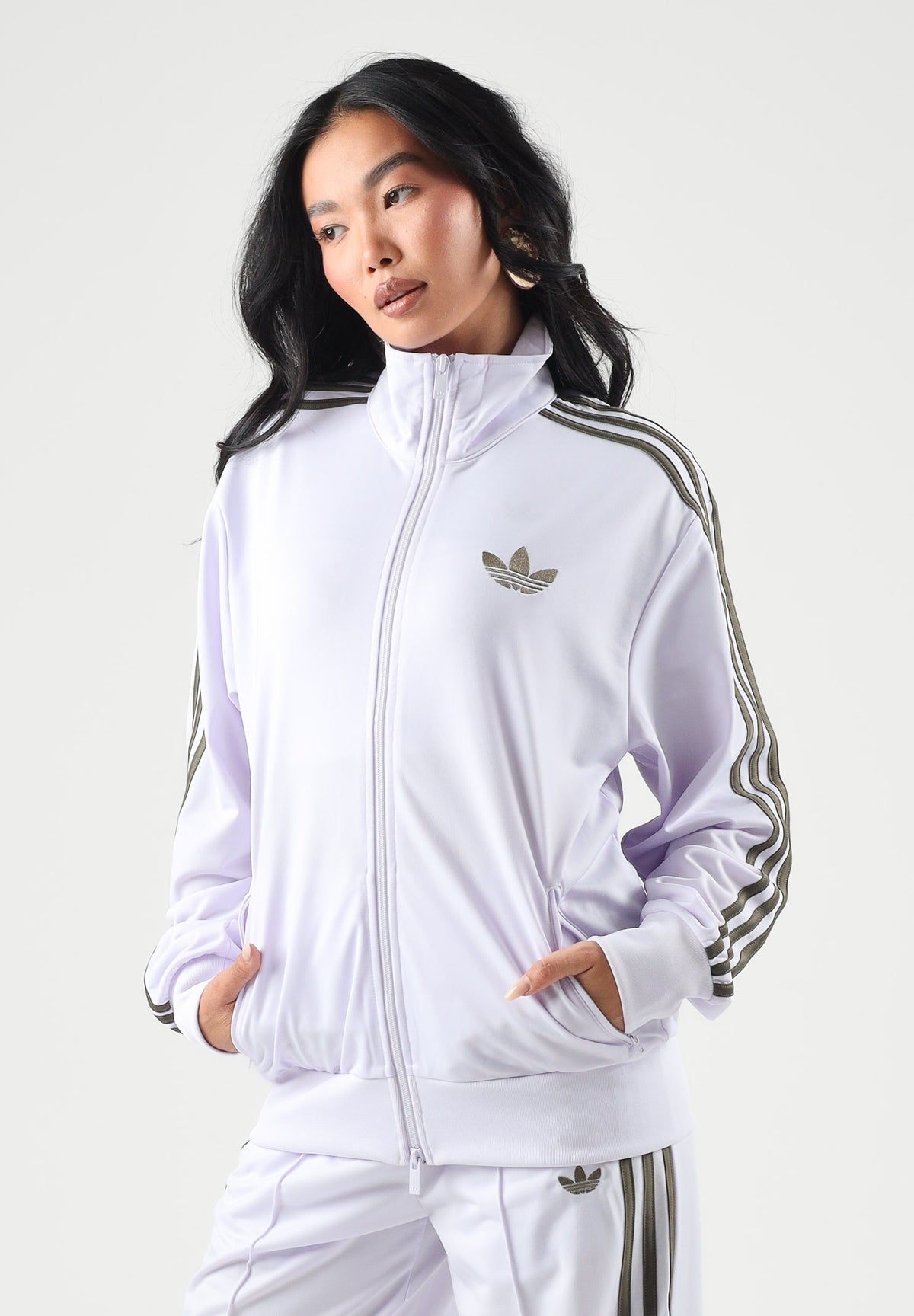ADIDAS ORIGINALS Felpa con zip FIREBIRD lilla da donna con 3-stripes iconiche e mini logo KU8195 . ADIDAS ORIGINALS