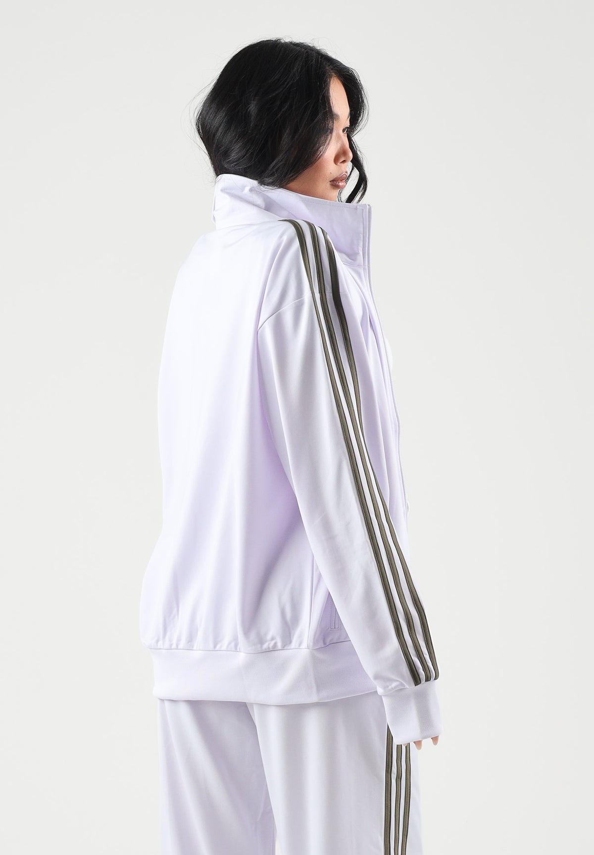 ADIDAS ORIGINALS Felpa con zip FIREBIRD lilla da donna con 3-stripes iconiche e mini logo KU8195 . ADIDAS ORIGINALS