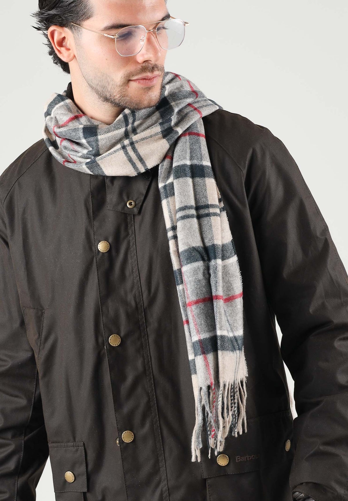 BARBOUR Sciarpa YAXLEY beige per uomo e donna con fondo chiaro a contrasto e nappe arrotolate. 262MUSC0324 TN31 BARBOUR