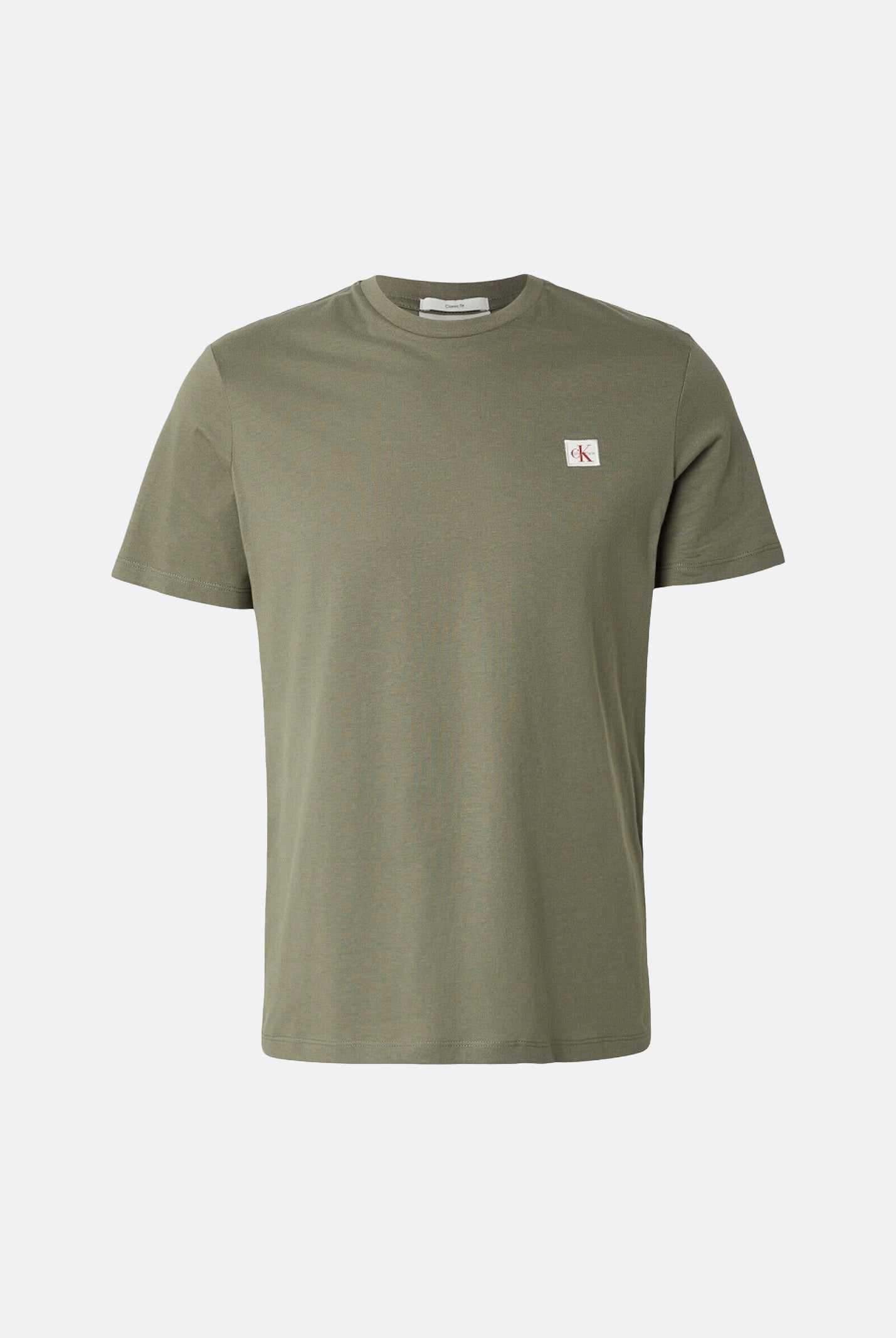 CALVIN KLEIN JEANS T-shirt COTTON BADGE, dusty-olive verde da uomo con piccolo stemma logo sul petto. <BR/> LV04RC272G LDY CALVIN KLEIN JEANS