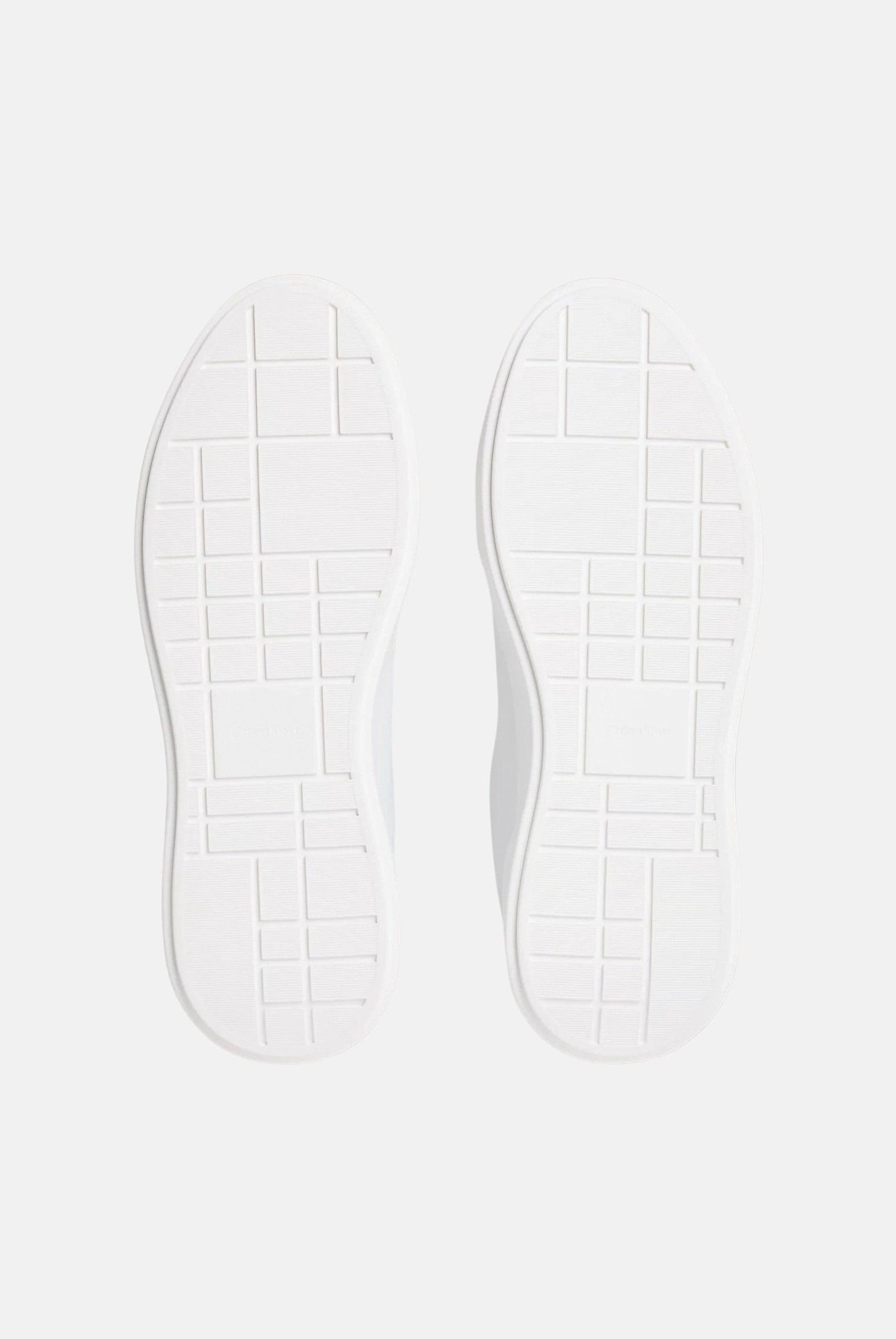 CALVIN KLEIN JEANS Sneakers in pelle bianche e nere da uomo con dettagli neri a contrasto e monogramma CK laterale.<BR/> YM0YM01344 06X CALVIN KLEIN JEANS