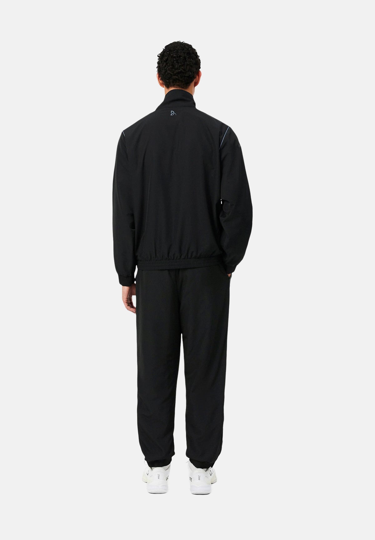 LACOSTE Tuta SOLID TRACKSUIT nera per uomo in tessuto tecnico con mini logo iconico WH6790 ZDQ LACOSTE