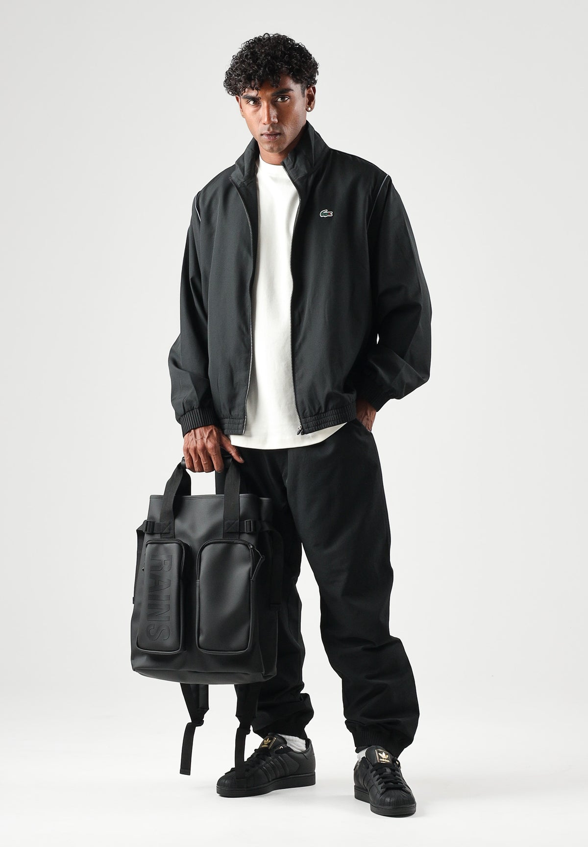 LACOSTE Tuta SOLID TRACKSUIT nera per uomo in tessuto tecnico con mini logo iconico WH6790 ZDQ LACOSTE