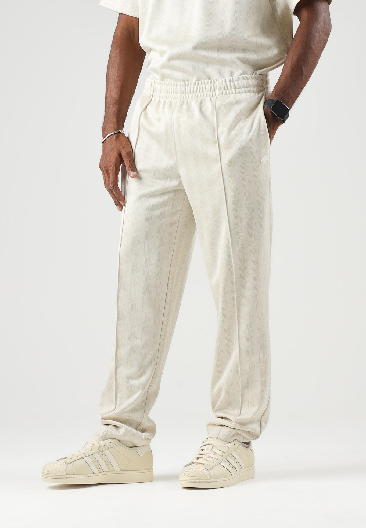 LACOSTE Pantaloni CASUAL TROUSERS panna per uomo con elastico in vita e tasche a filetto. XH0197 8LX LACOSTE