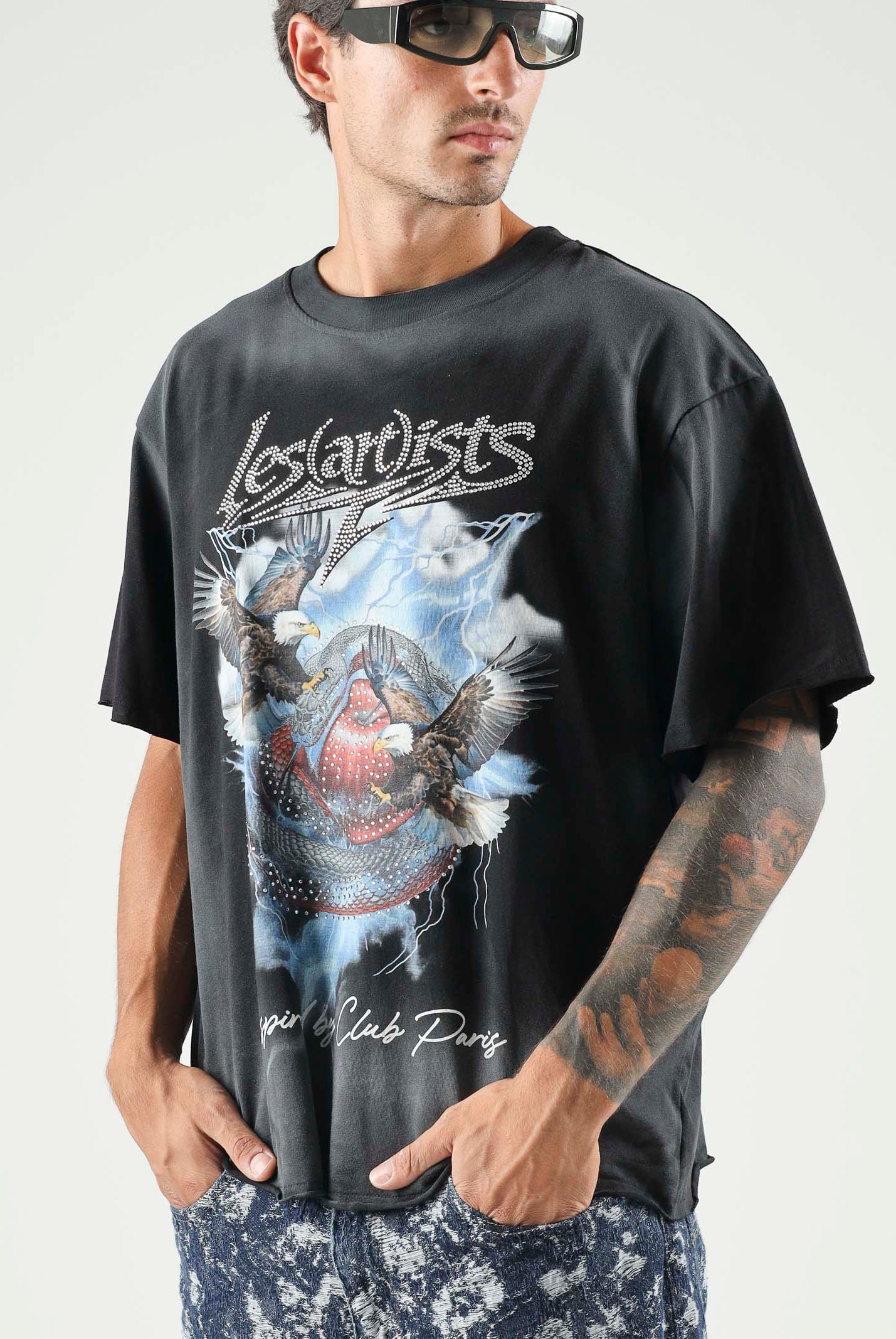 LES ARTISTS T-shirt EAGLES nera per uomo e donna con maxi stampa grafica frontale multicolore ed effetto vintage. 27SSLATS1134 121 LES ARTISTS