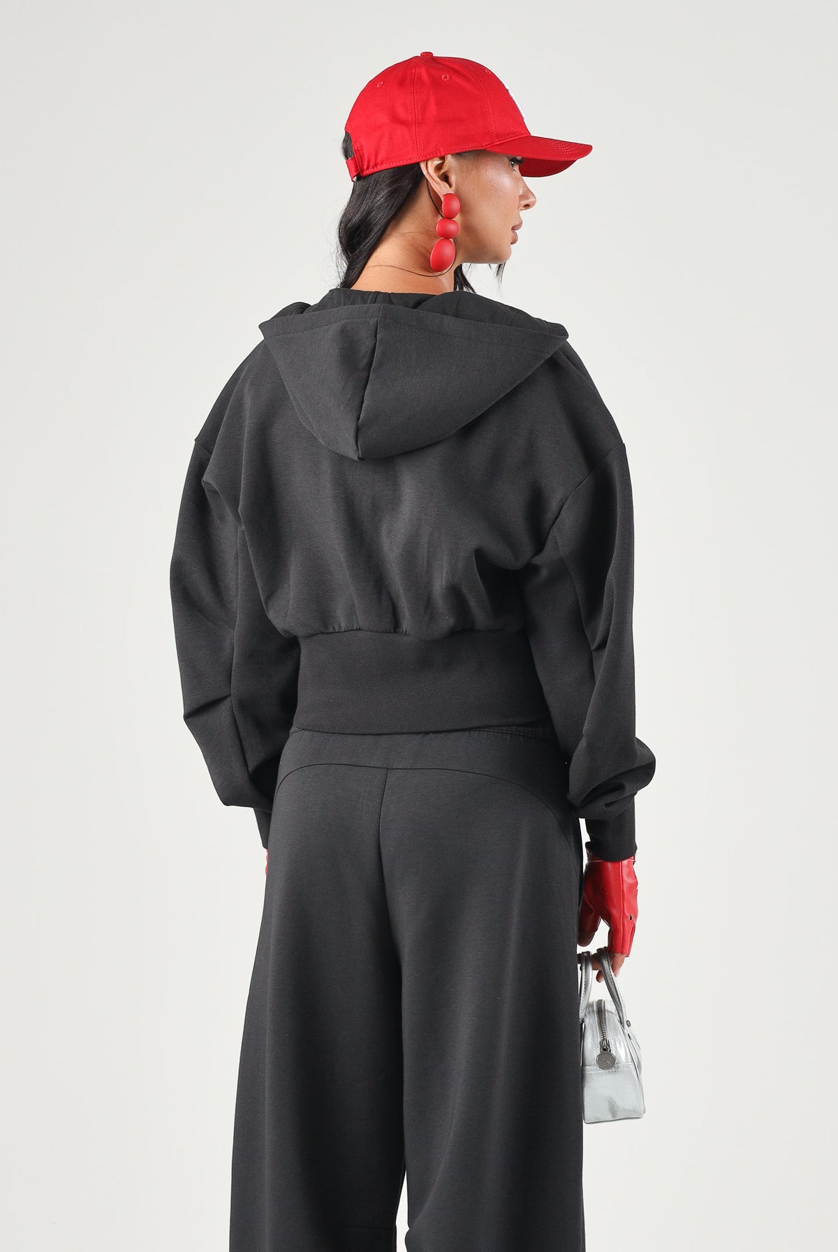 PUMA Felpa con zip PUMATECH nera per donna con cappuccio e taglio cropped. 634571 01 PUMA