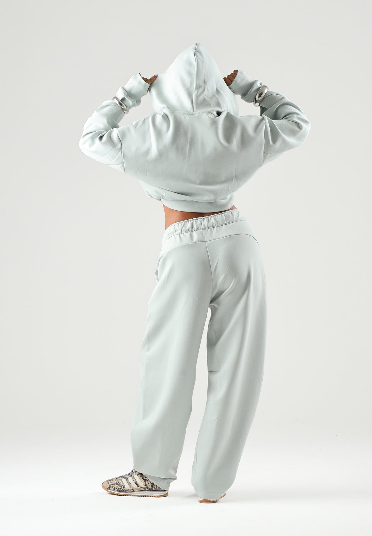 PUMA Felpa PUMATECH verde acqua per donna con cappuccio, zip parziale e taglio cropped. 634571 29 PUMA