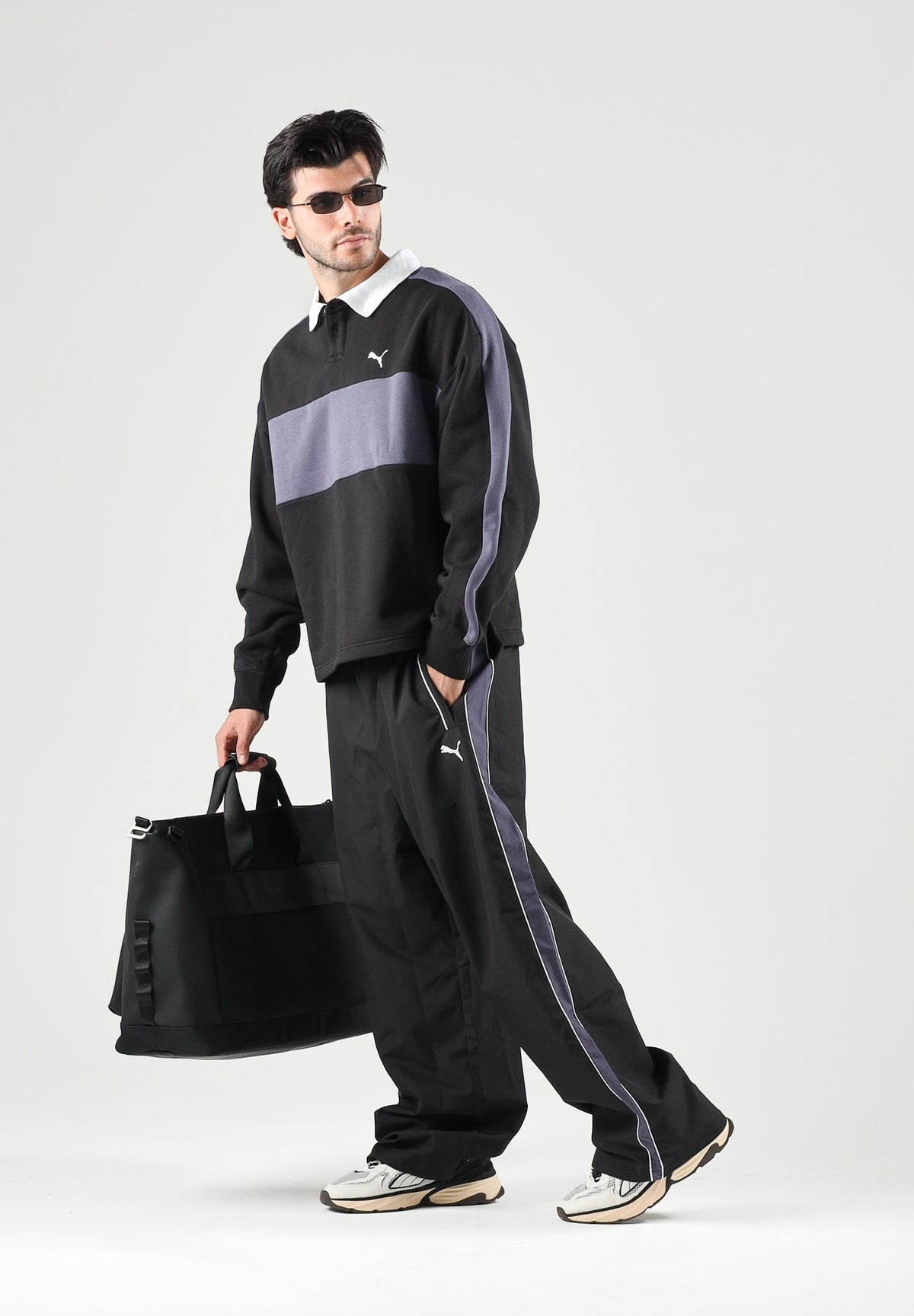 PUMA Pantalone nero da uomo con bande laterali e logo iconico 637378 01 PUMA