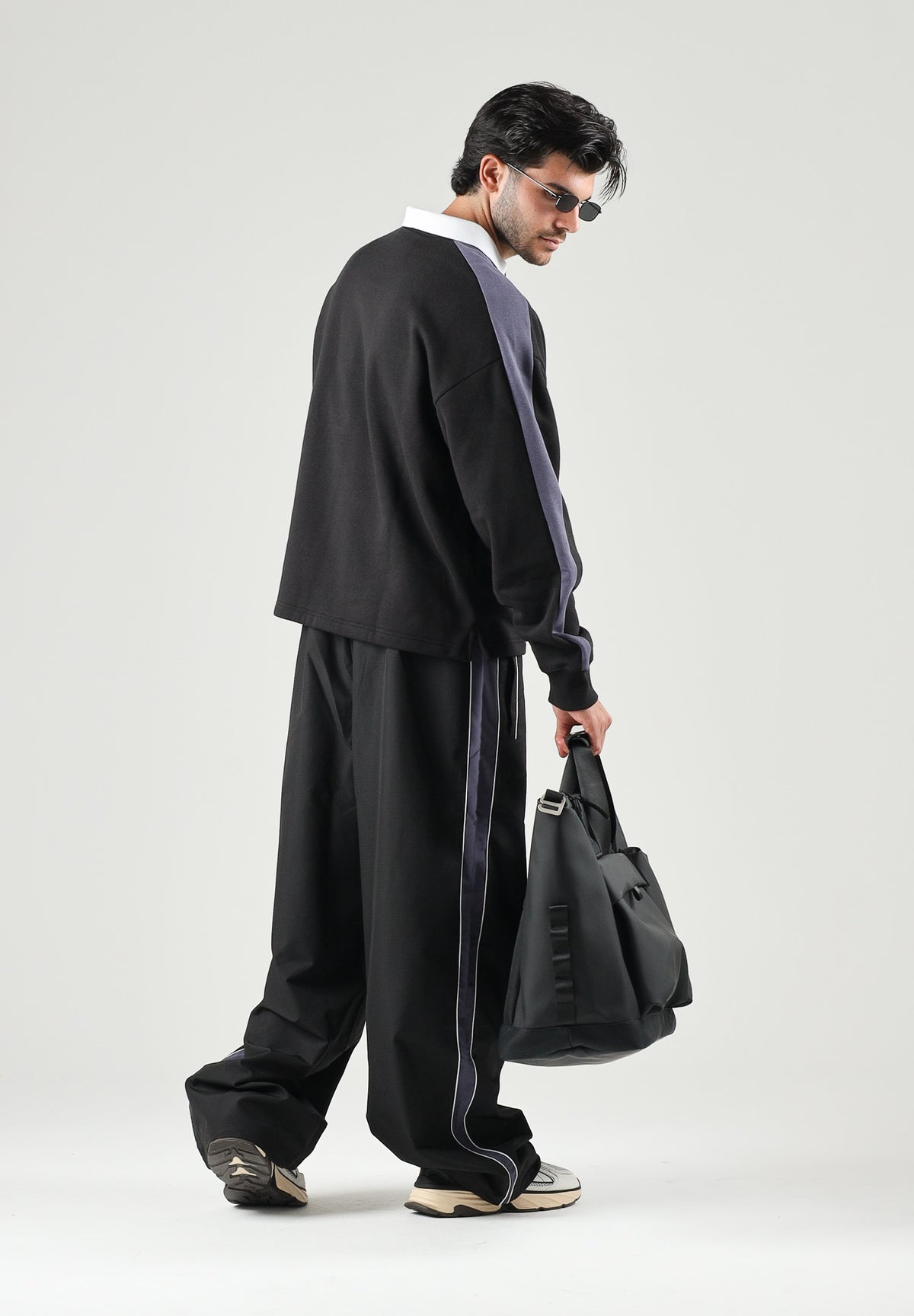 PUMA Pantalone nero da uomo con bande laterali e logo iconico 637378 01 PUMA