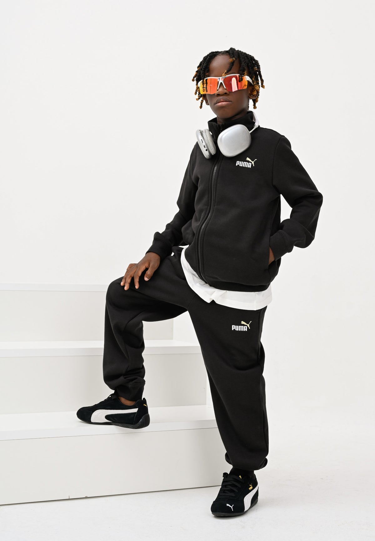 PUMA Tuta nera per bambina e bambino con zip intera e logo gatto ricamato a contrasto. 691934 51 PUMA