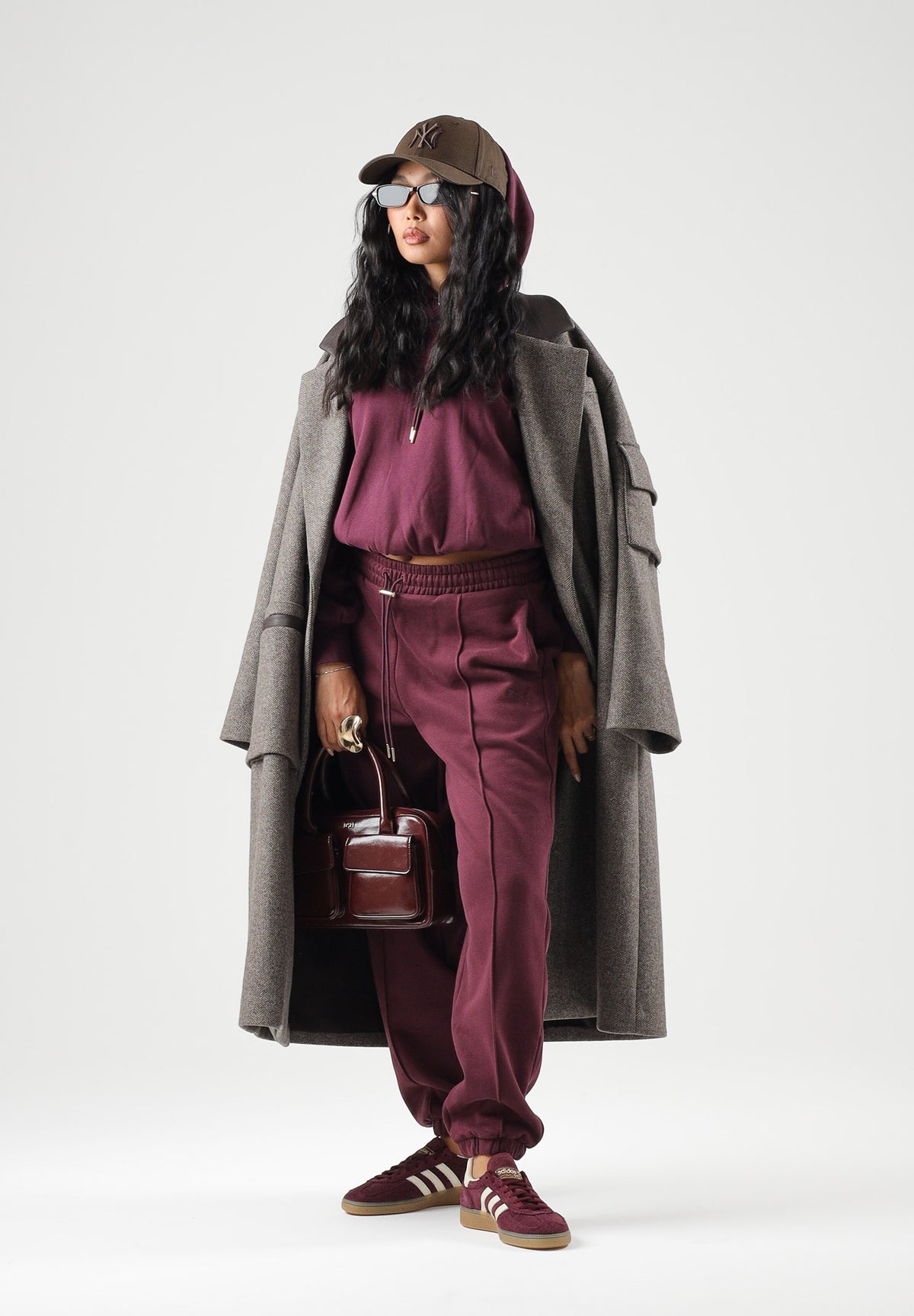 PUMA Felpa con cappuccio HOODIE bordeaux da donna con maniche a palloncino<BR/> 694027 24 PUMA
