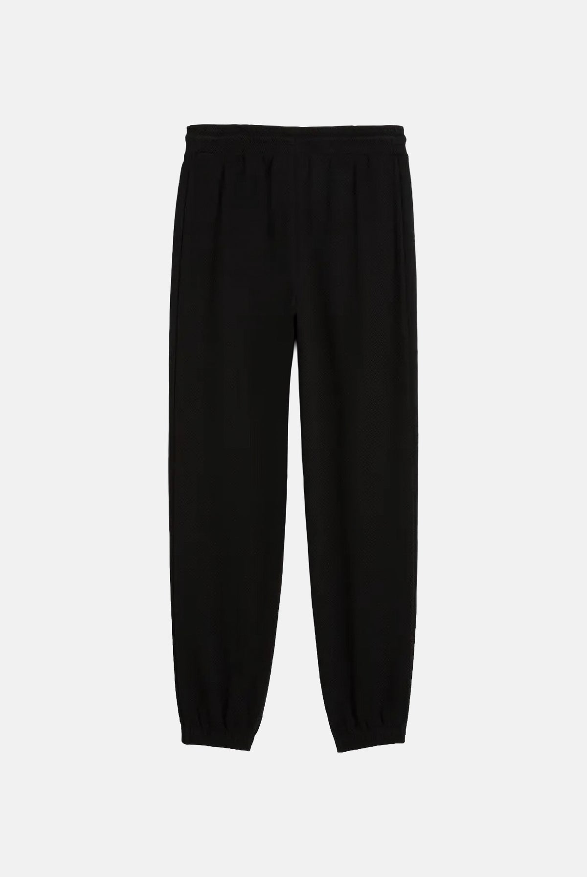 PUMA Pantaloni TRACK PANTS neri da uomo con profili laterali e fondo con polsino. 694300 01 PUMA