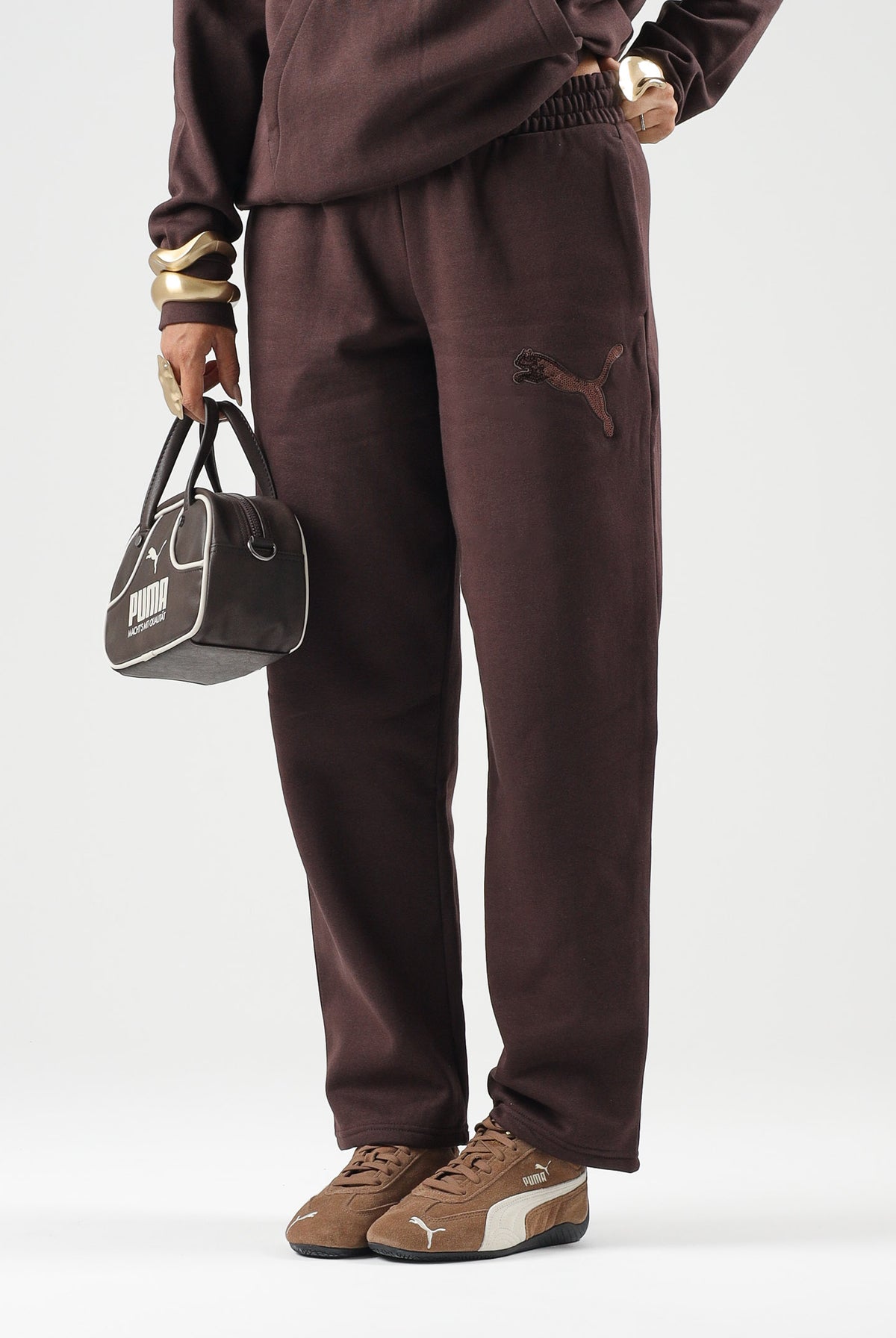 PUMA Pantaloni RHINESTON OPEN marrone da donna con logo in strass e fondo dritto. 694578 33 PUMA