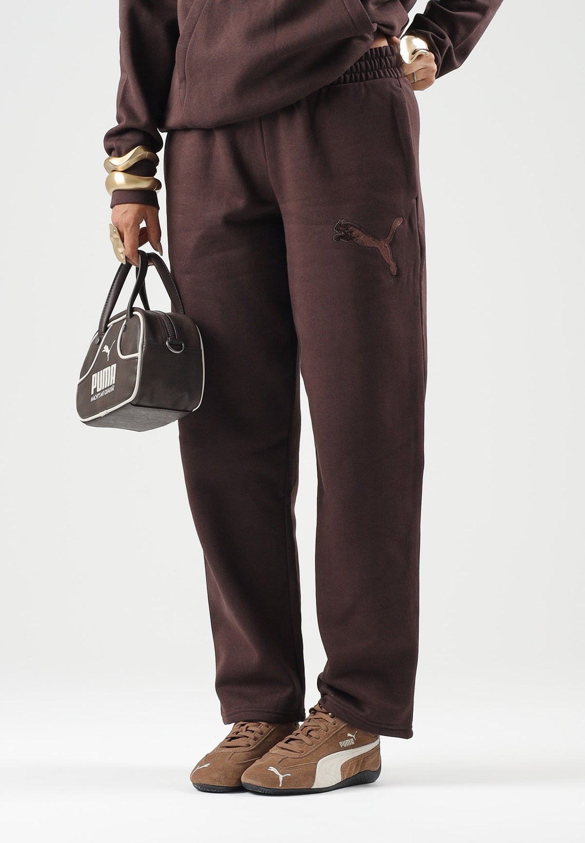 PUMA Pantaloni RHINESTON OPEN marrone da doonna con logo in strass e fondo dritto. 694578 33 PUMA