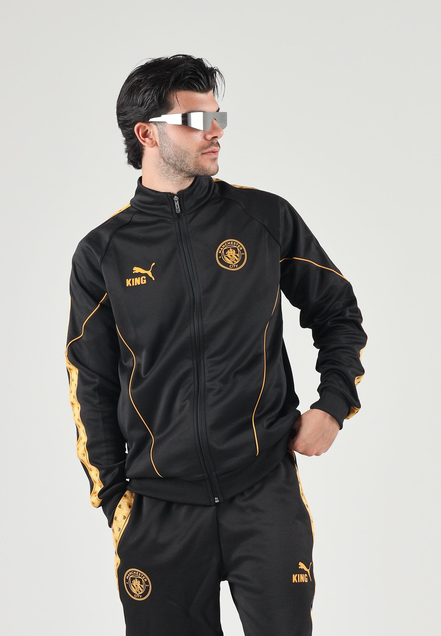 PUMA Felpa con zip MANCHESTER CITY TRACK JACKET nero da uomo dettagli oro. 786296 32 PUMA