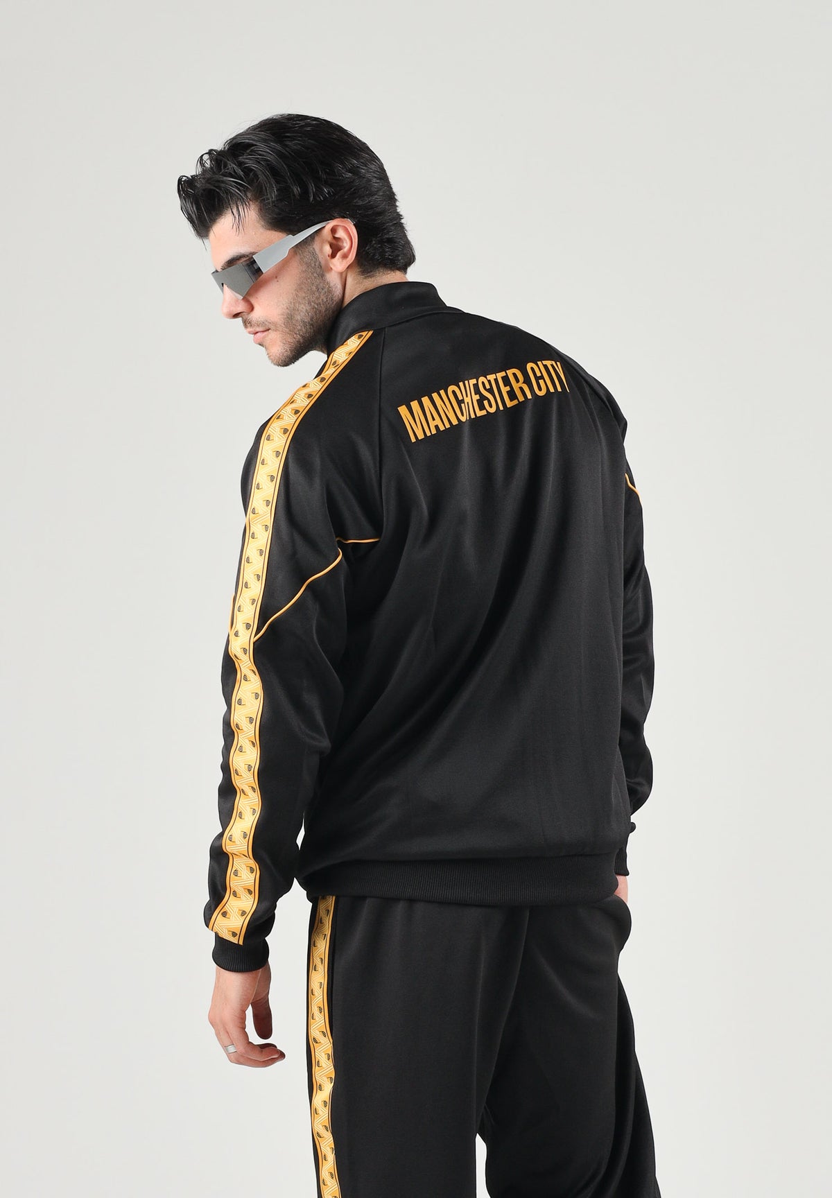 PUMA Felpa con zip MANCHESTER CITY TRACK JACKET nero da uomo dettagli oro. 786296 32 PUMA