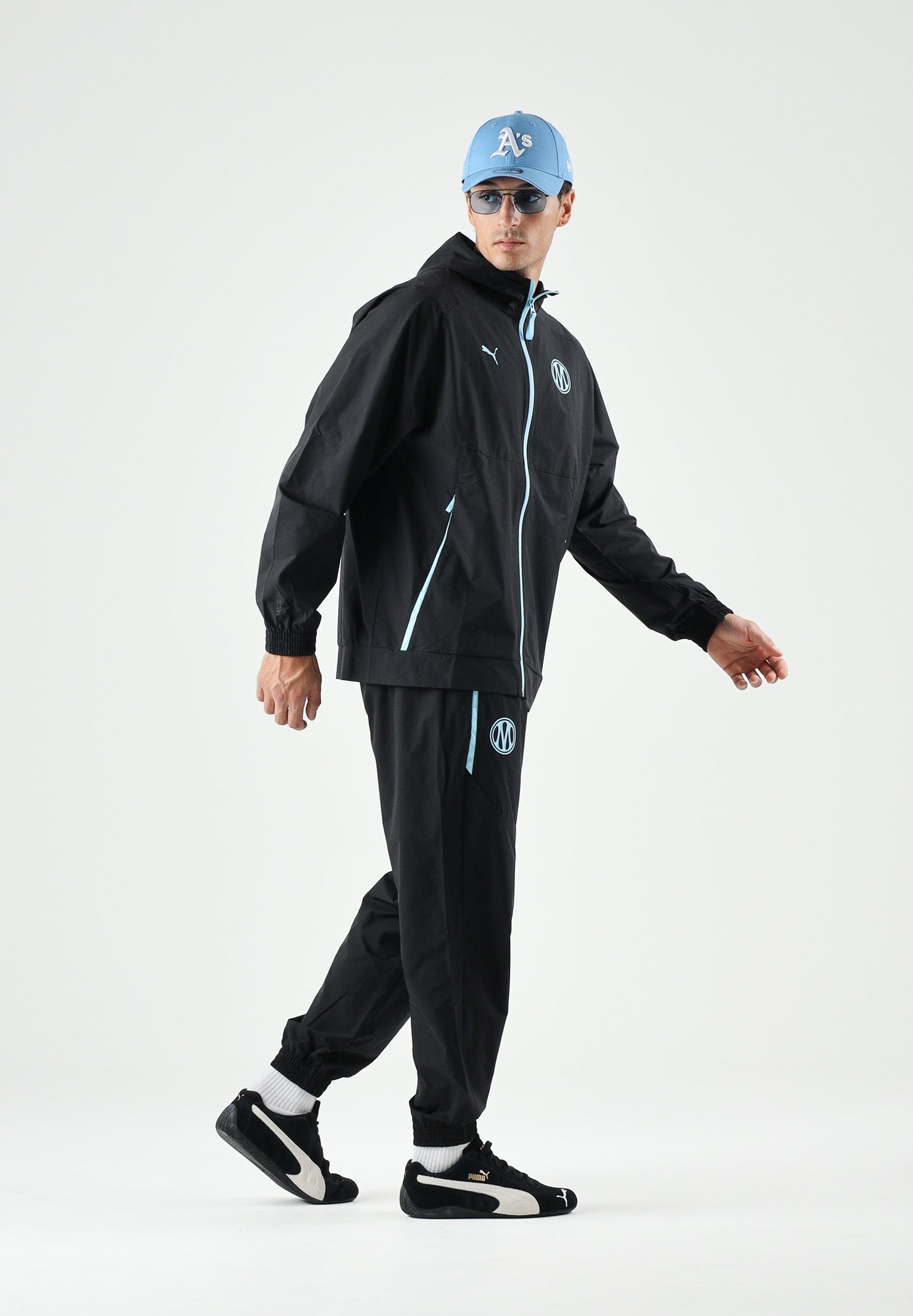 PUMA Pantaloni OLYMPIQUE DE MARSEILLE vibrant blue, blu e nero da uomo con dettagli logo e stemma 786450 20 PUMA