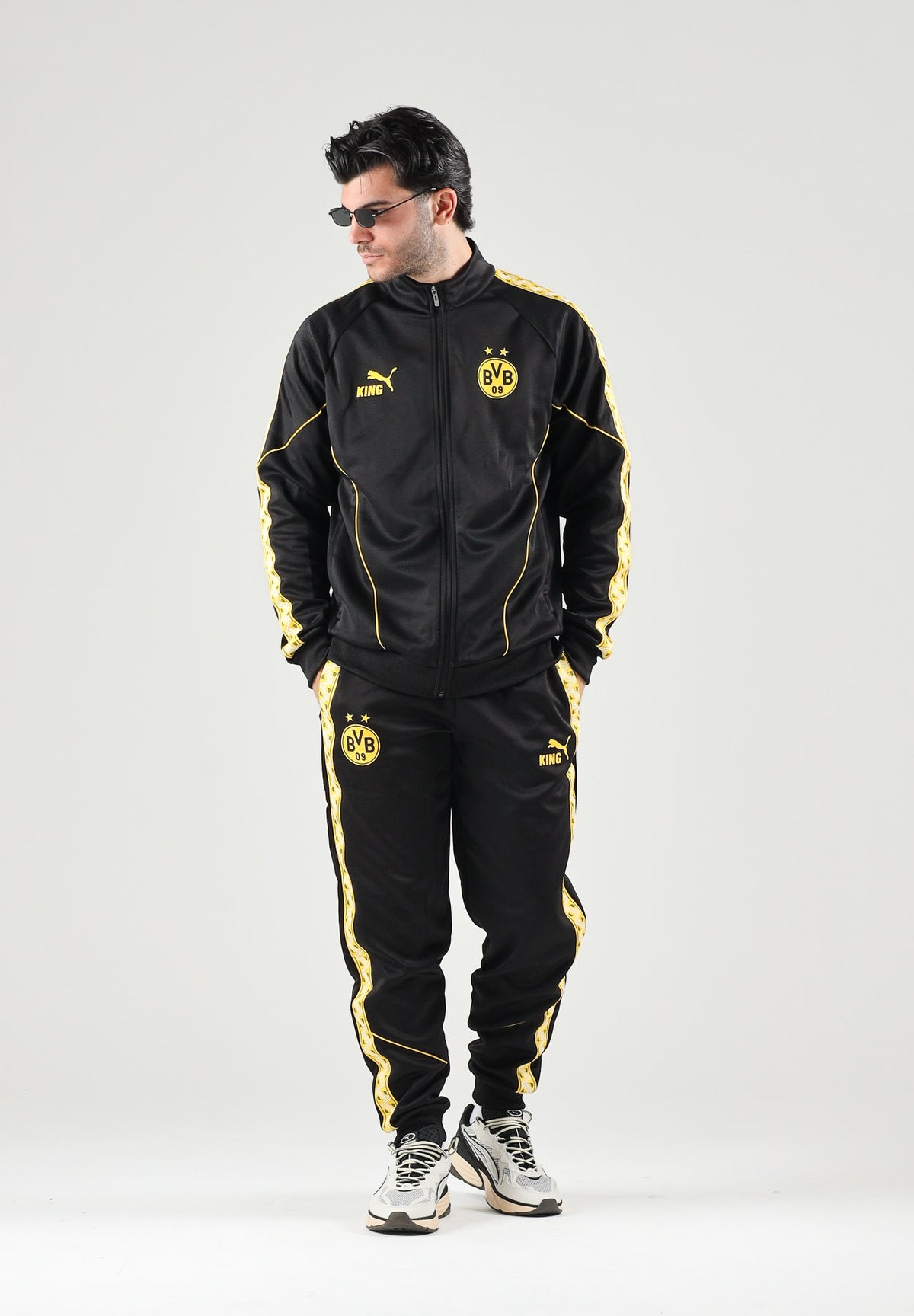 PUMA Felpa con zip BORUSSIA DORTMUND nero da uomo con dettagli gialli e stemma del club. 786491 07 PUMA