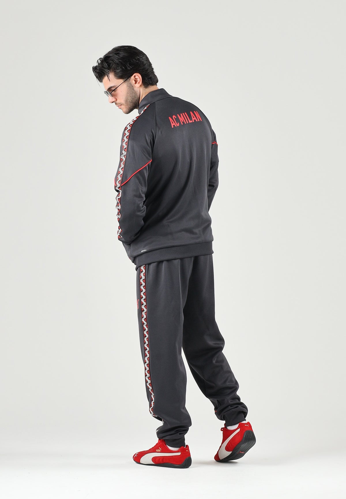 PUMA Felpa con zip AC MILAN TRACK JACKET nero da uomo con colletto alto e profili rossi. 786735 17 PUMA