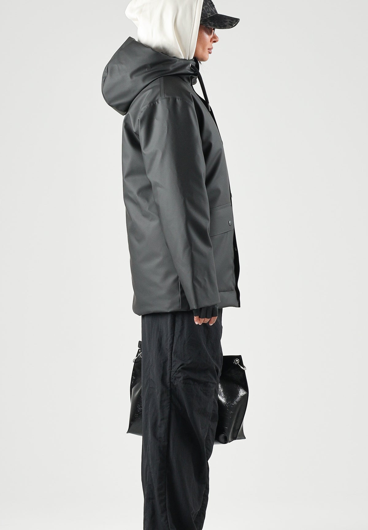 RAINS Parka nero per uomo e donna con cappuccio e visiera RA21450 BL RAINS