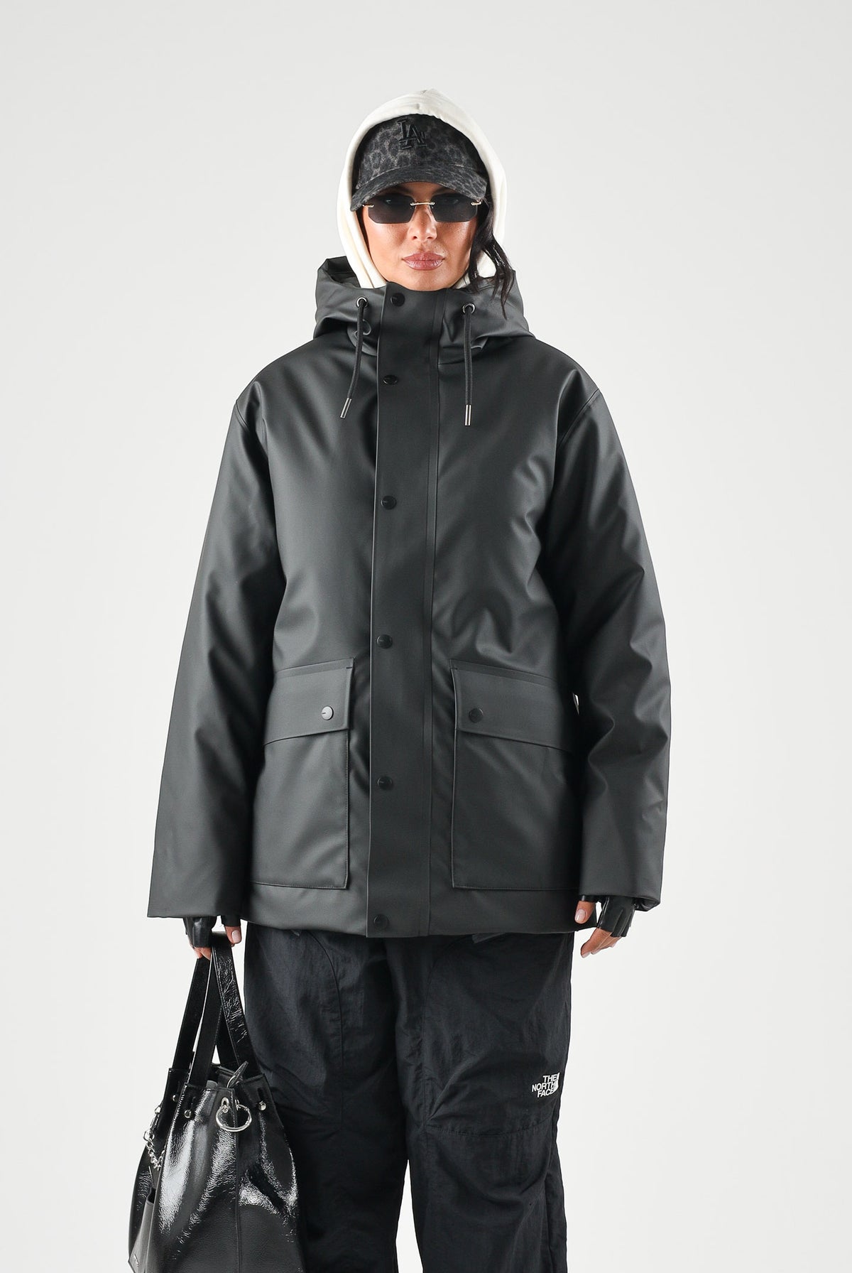 RAINS Parka nero per uomo e donna con cappuccio e visiera RA21450 BL RAINS