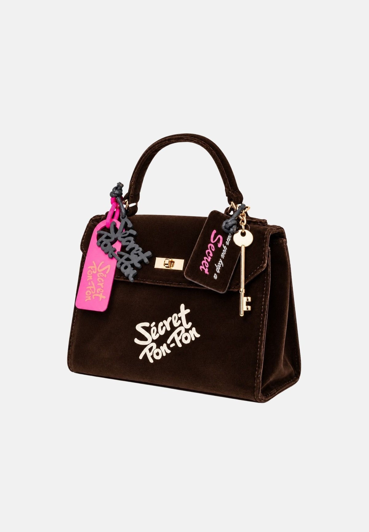 SECRET PON PON Borsa a mano LAUREEN VELVET Cocoa Velvet marrone scuro da donna, in velluto con manico arcuato, charm fucsia e logo frontale. LAUREEN-VELVET CO SECRET PON PON