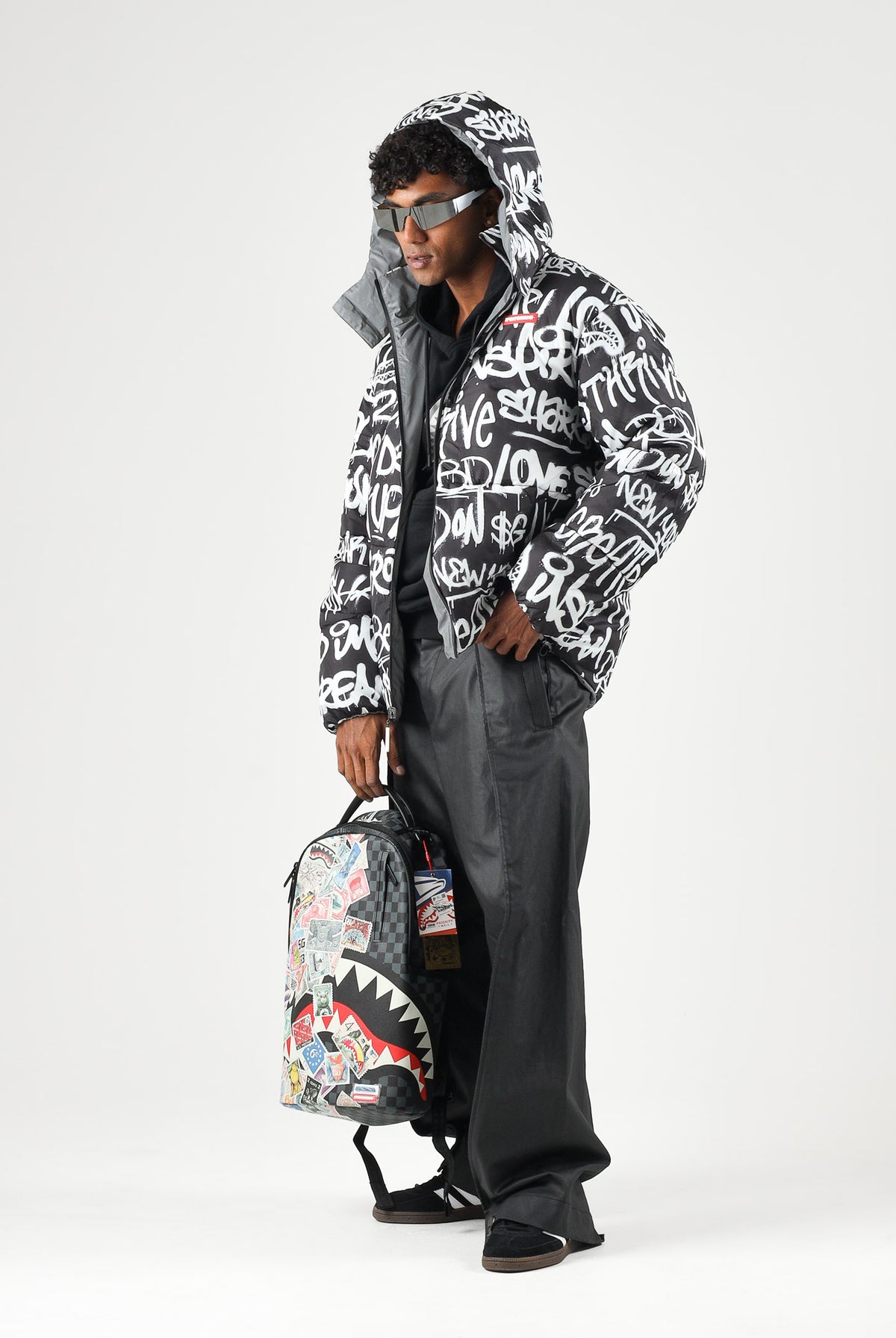 SPRAYGROUND Piumino grigio reversibile per uomo e donna con cappuccio regolabile, chiusura frontale con zip SP942 . SPRAYGROUND
