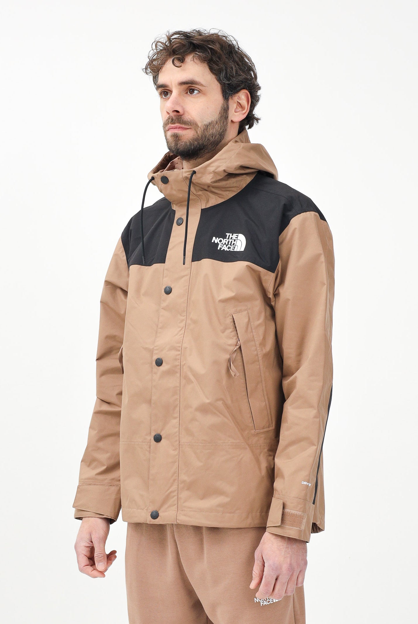 THE NORTH FACE Giacca a vento Reign On marrone e nera da uomo NF0A8B5G58W1 . THE NORTH FACE