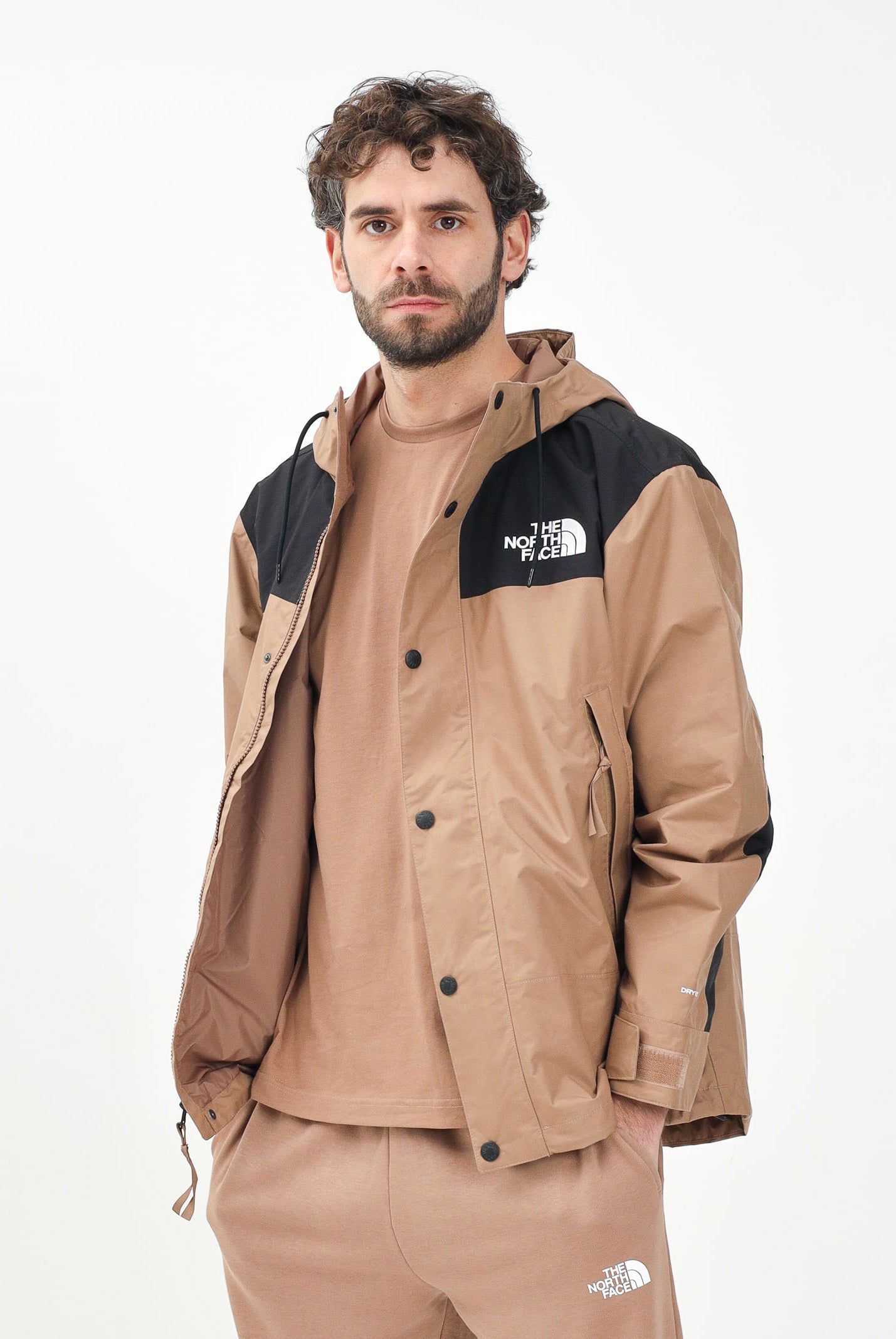 THE NORTH FACE Giacca a vento Reign On marrone e nera da uomo NF0A8B5G58W1 . THE NORTH FACE