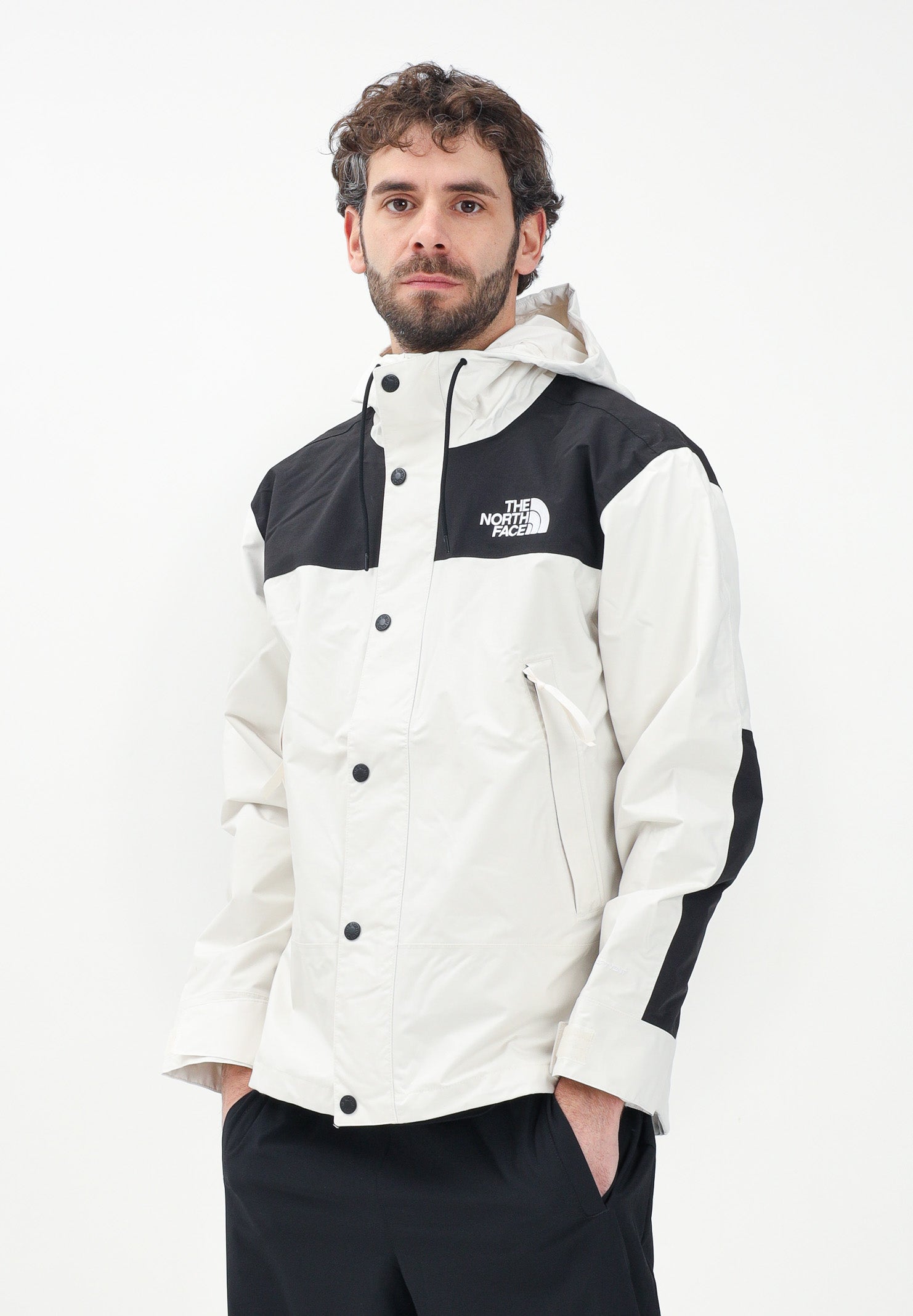 THE NORTH FACE Giacca a vento Reign On bianca e nera da uomo NF0A8B5GROU1 . THE NORTH FACE
