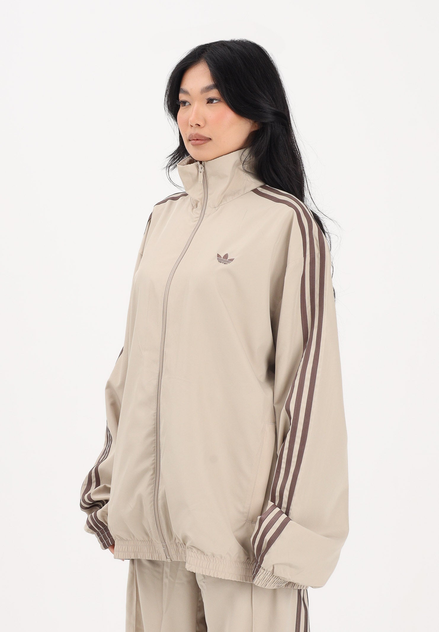 ADIDAS ORIGINALS Giacca a vento Firebird Adilenium beige da donna KD6297 . ADIDAS ORIGINALS
