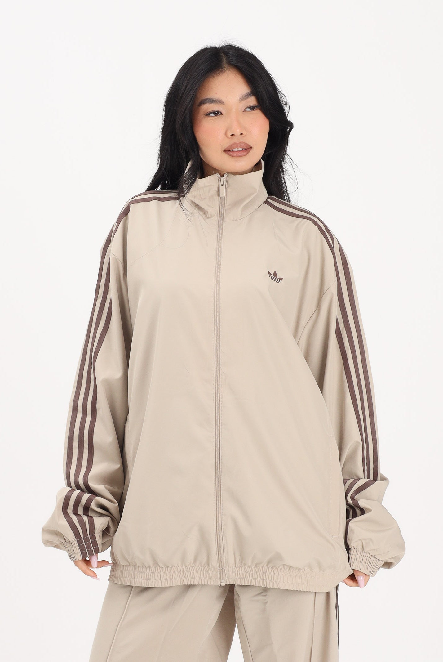 ADIDAS ORIGINALS Giacca a vento Firebird Adilenium beige da donna KD6297 . ADIDAS ORIGINALS