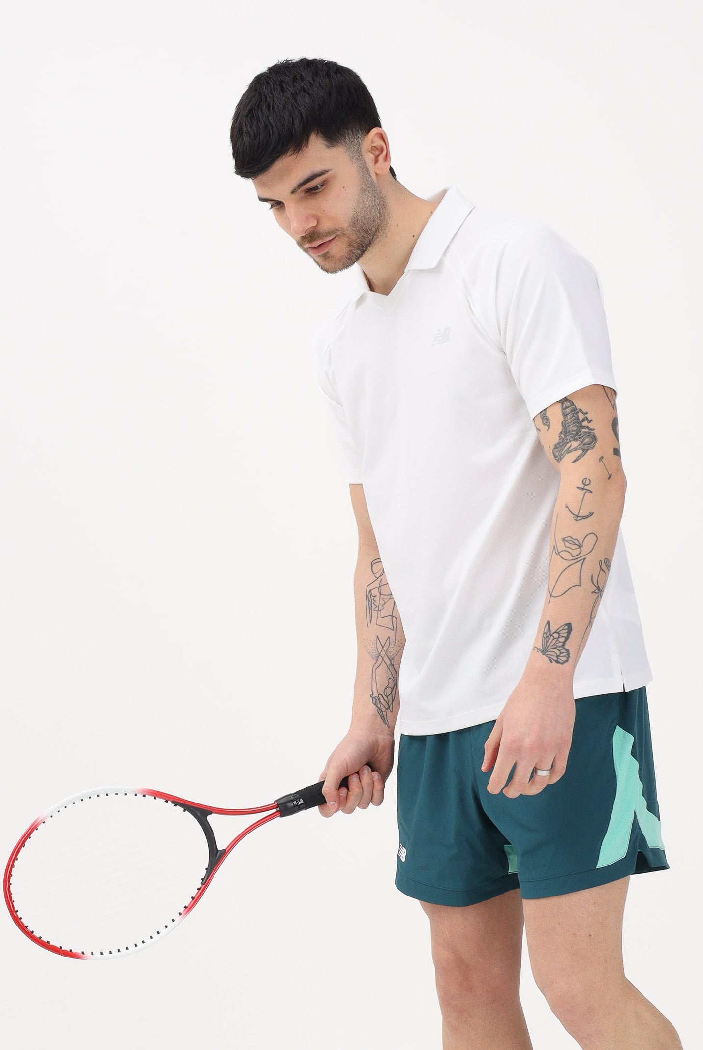 NEW BALANCE Polo a manica corta Tournament Dry bianca da uomo MT61W0HTWT . NEW BALANCE