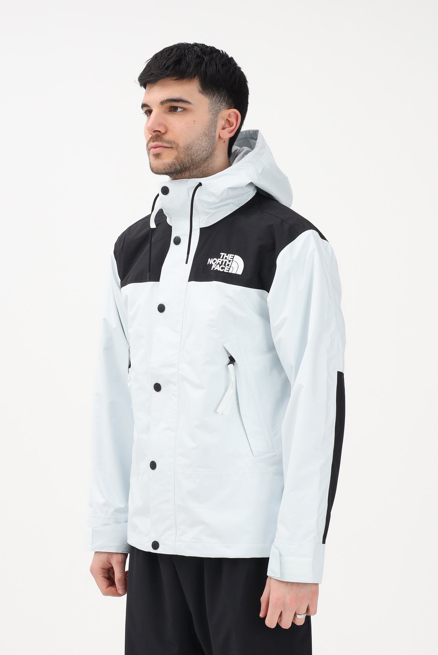 THE NORTH FACE Giacca a vento Reign On celeste e nera da uomo NF0A8B5GJL61 . THE NORTH FACE