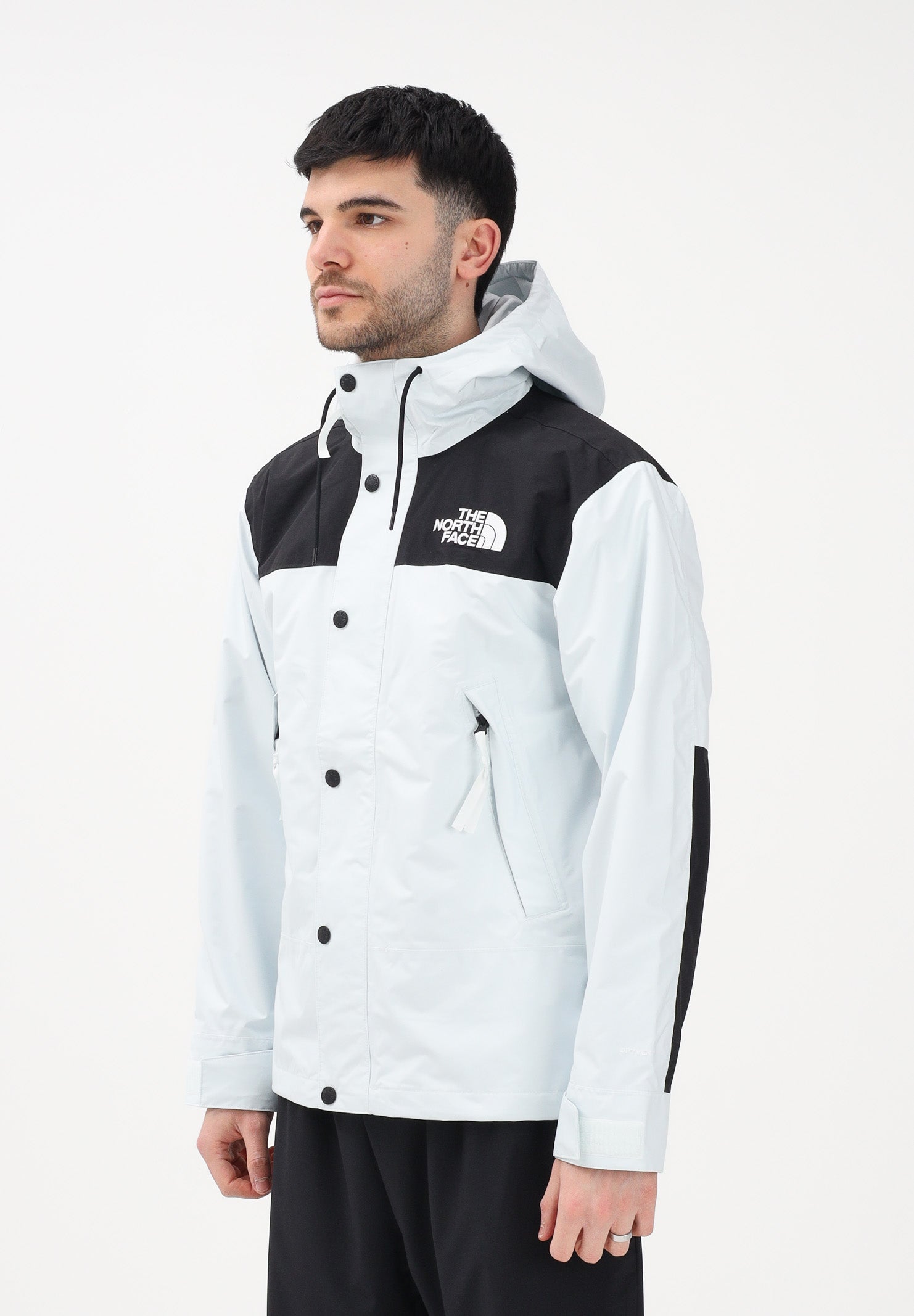 THE NORTH FACE Giacca a vento Reign On celeste e nera da uomo NF0A8B5GJL61 . THE NORTH FACE