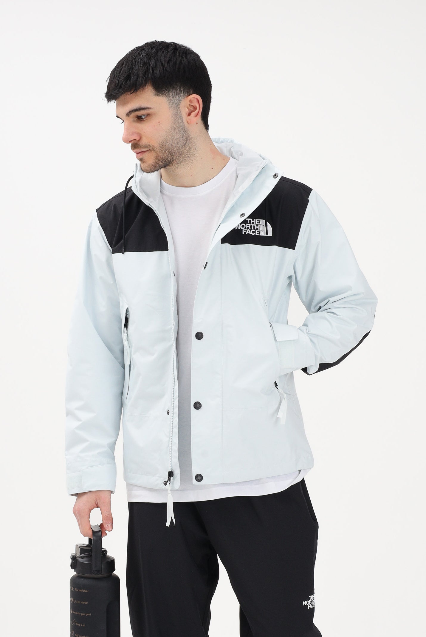 THE NORTH FACE Giacca a vento Reign On celeste e nera da uomo NF0A8B5GJL61 . THE NORTH FACE