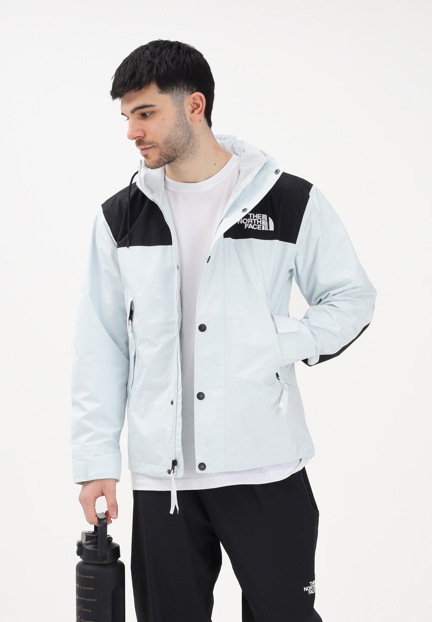 THE NORTH FACE Giacca a vento Reign On celeste e nera da uomo NF0A8B5GJL61 . THE NORTH FACE