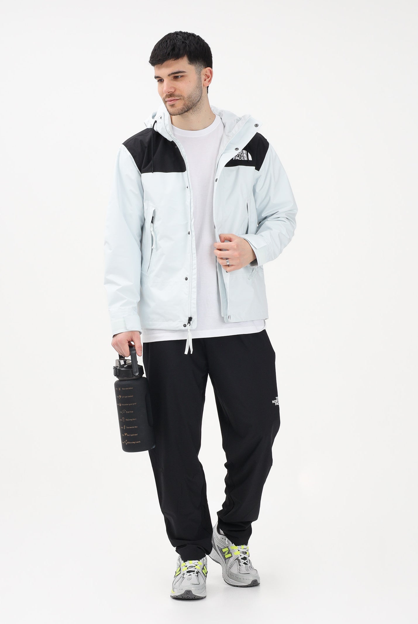 THE NORTH FACE Giacca a vento Reign On celeste e nera da uomo NF0A8B5GJL61 . THE NORTH FACE
