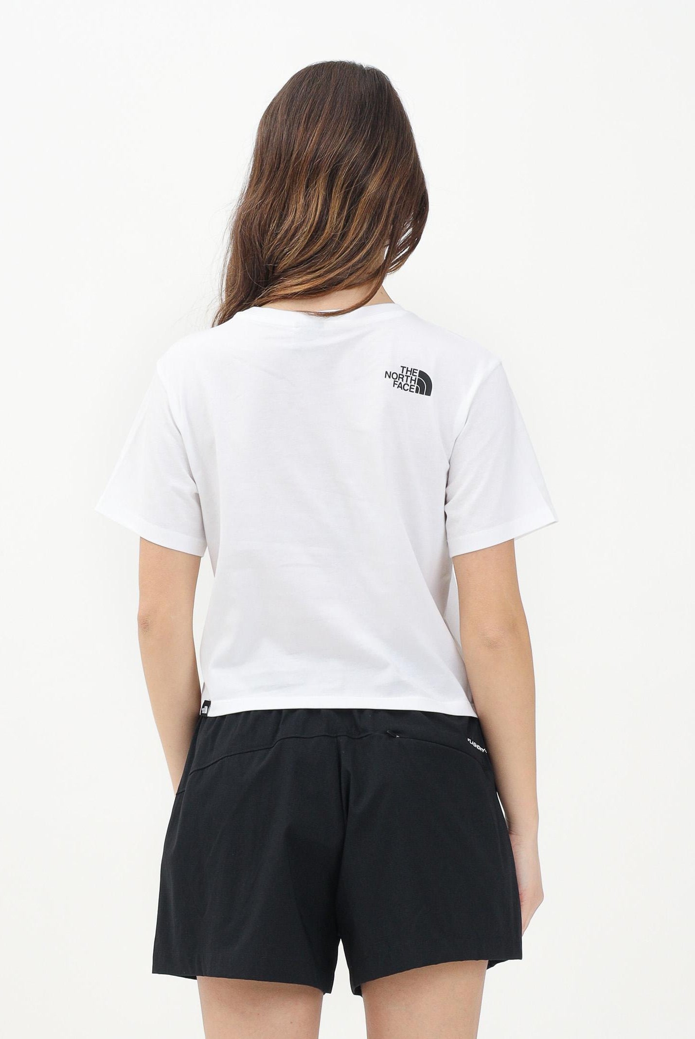 THE NORTH FACE T-shirt a manica corta Cropped bianca da donna con logo NF0A87U4FN41 . THE NORTH FACE