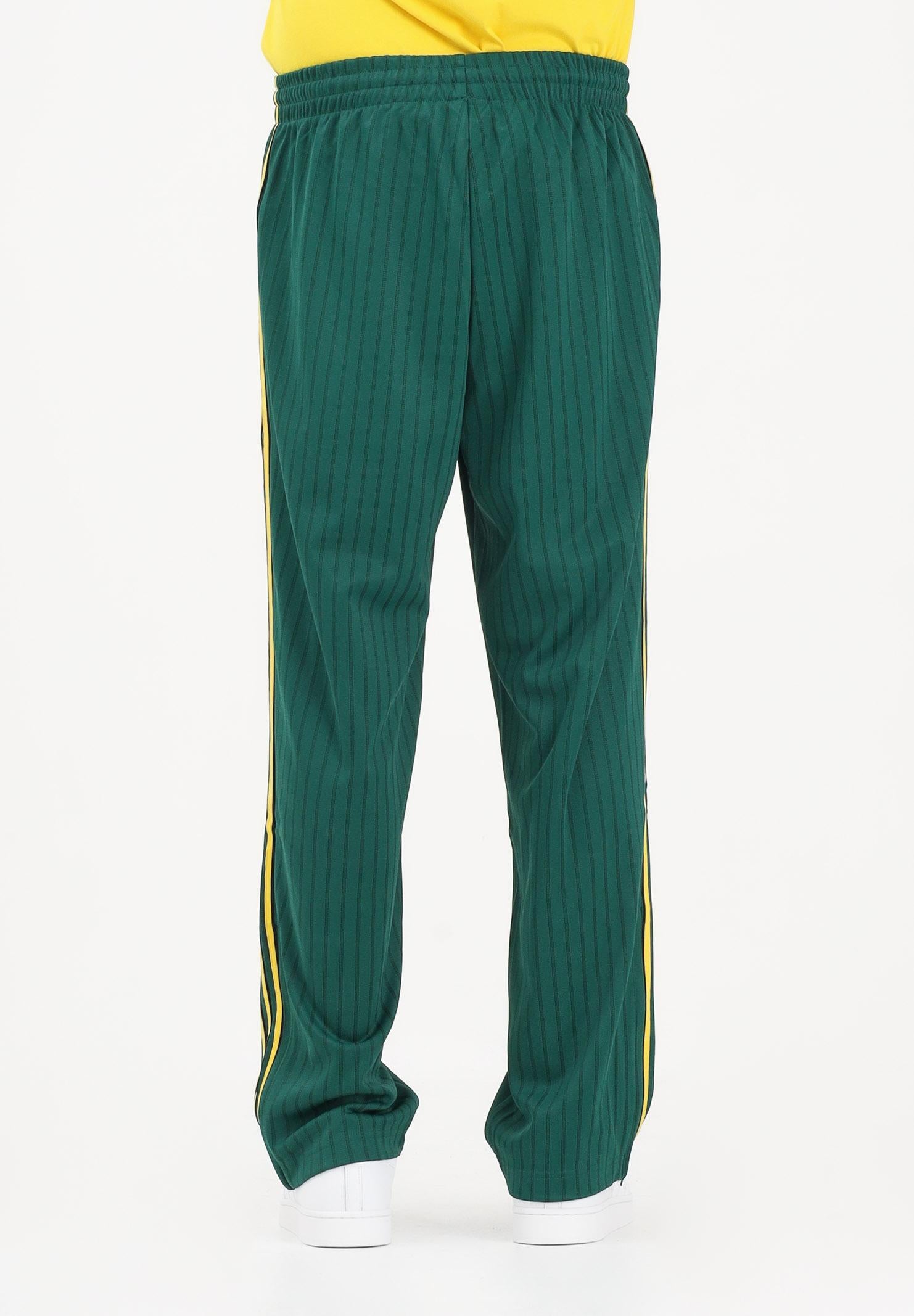 ADIDAS ORIGINALS Pantalone sportivo Firebird Loose Pinstripes verde e giallo da uomo KE3456 . ADIDAS ORIGINALS
