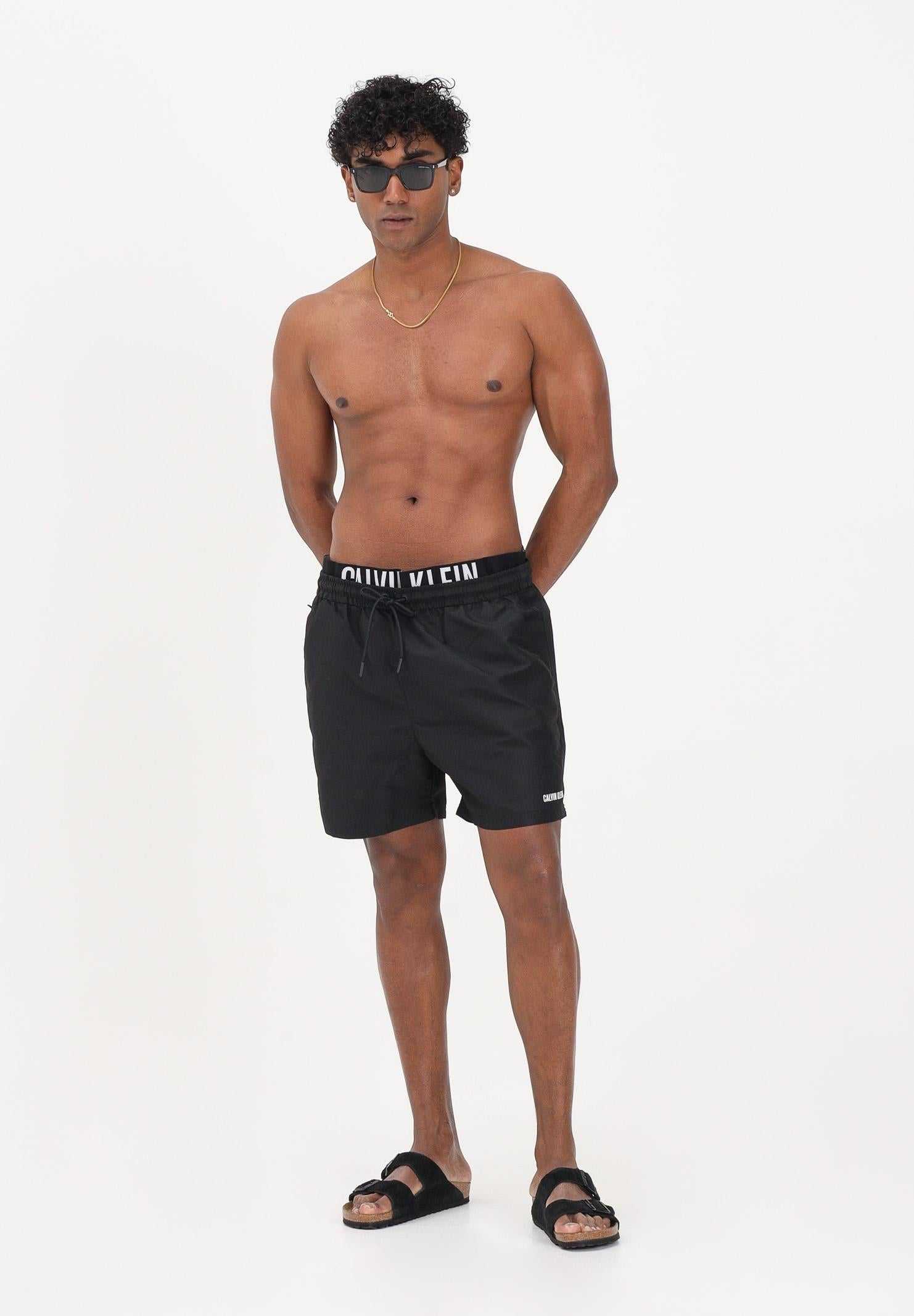 CALVIN KLEIN Shorts mare nero da uomo con elastico logato LV00N61015 UB1 CALVIN KLEIN
