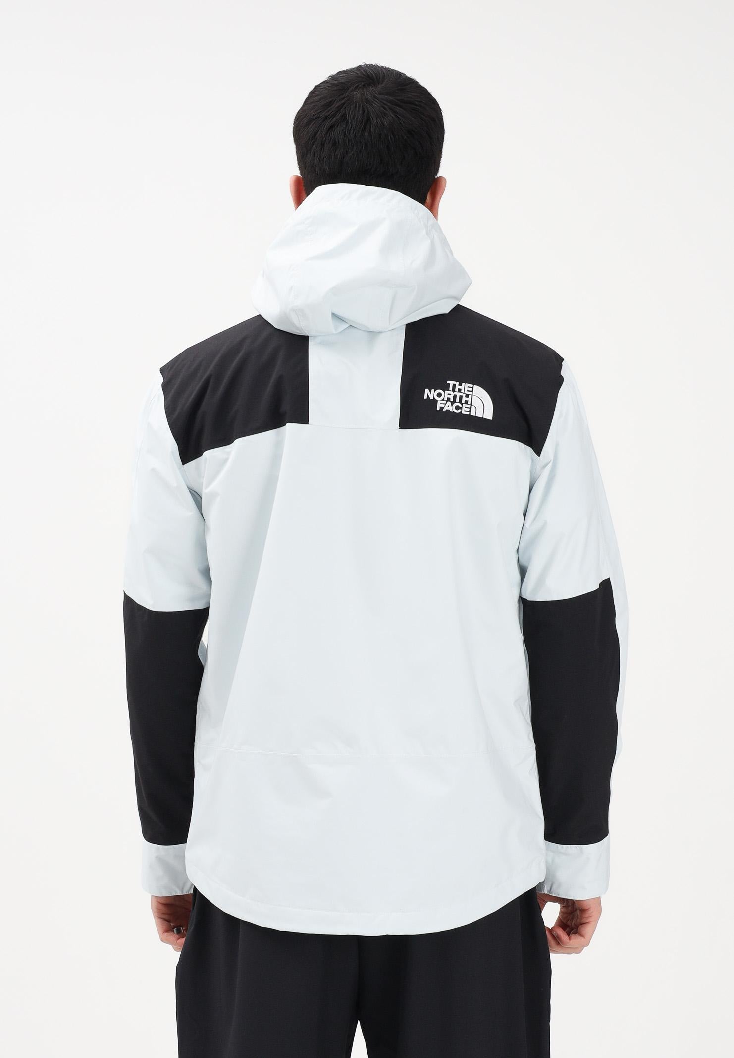THE NORTH FACE Giacca a vento Reign On celeste e nera da uomo NF0A8B5GJL61 . THE NORTH FACE