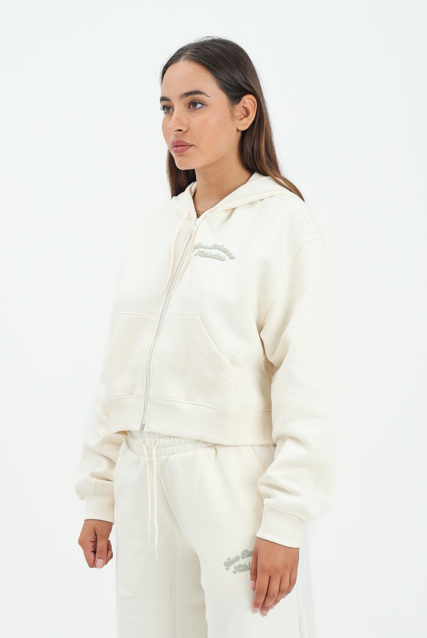 NEW BALANCE felpa con zip panna da donna con interno felpato WJ53509PEF . NEW BALANCE