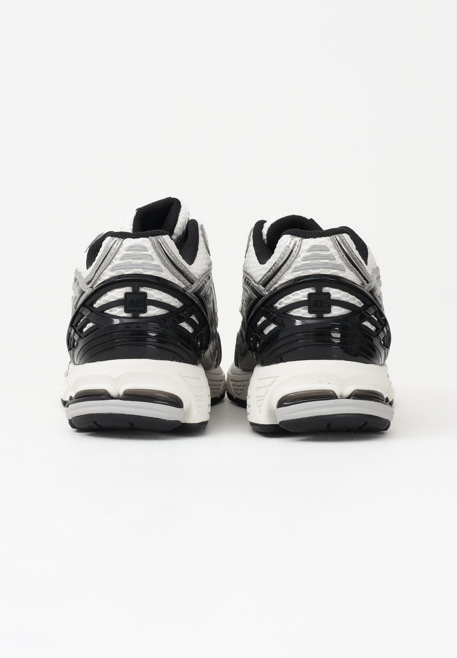 NEW BALANCE Sneakers 1906 bianche, argento e nere da uomo M1906RER . NEW BALANCE