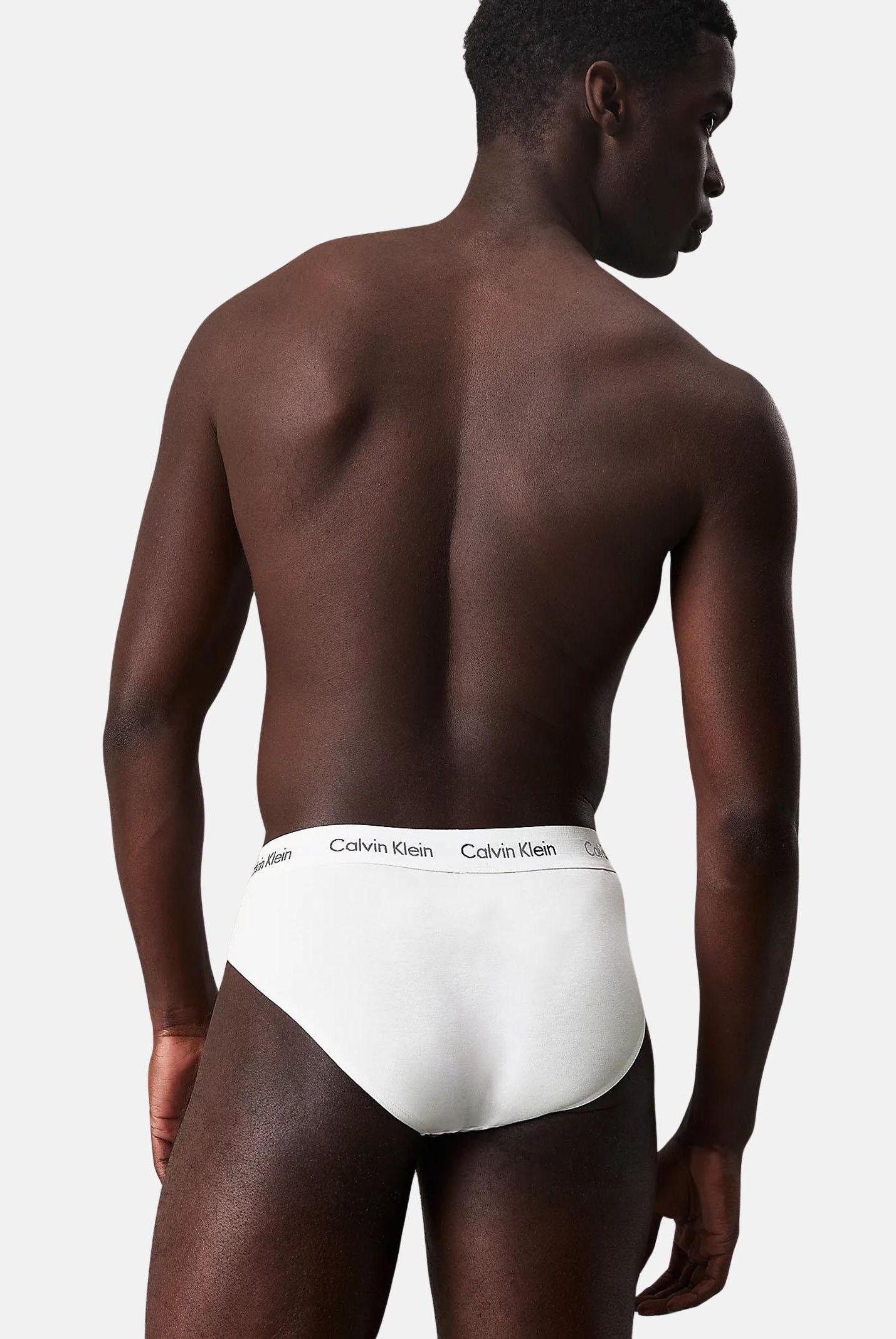 CALVIN KLEIN Set composto da tre slip bianchi da uomo con vita elastica logata 000NB3962A 100 CALVIN KLEIN