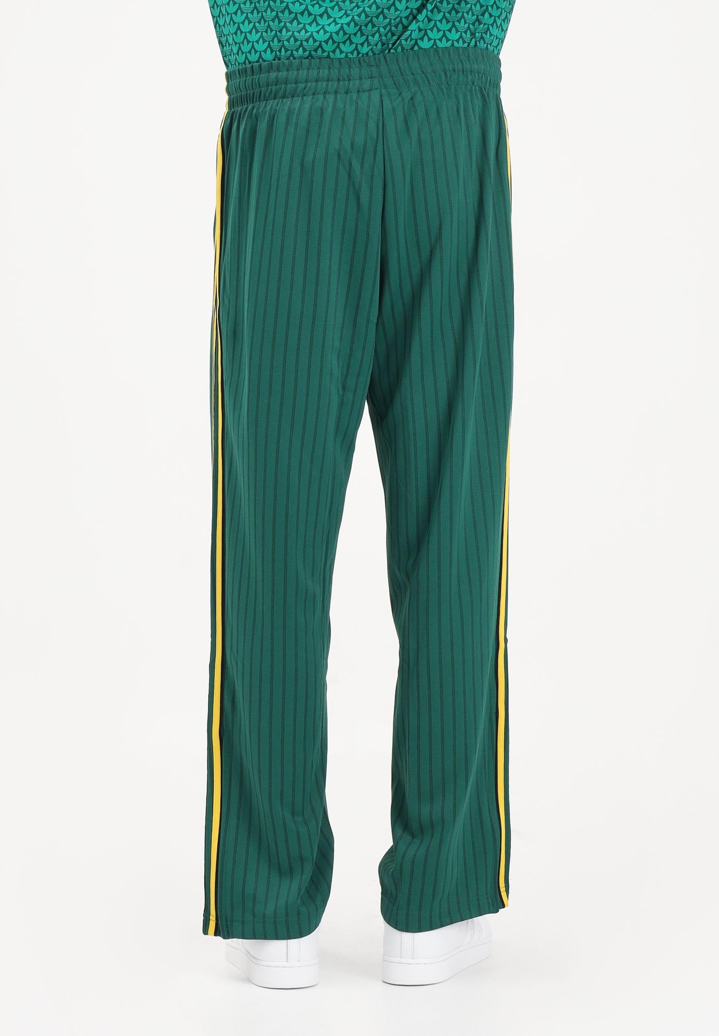 ADIDAS ORIGINALS Pantalone sportivo Firebird Loose Pinstripes verde e giallo da uomo KE3456 . ADIDAS ORIGINALS