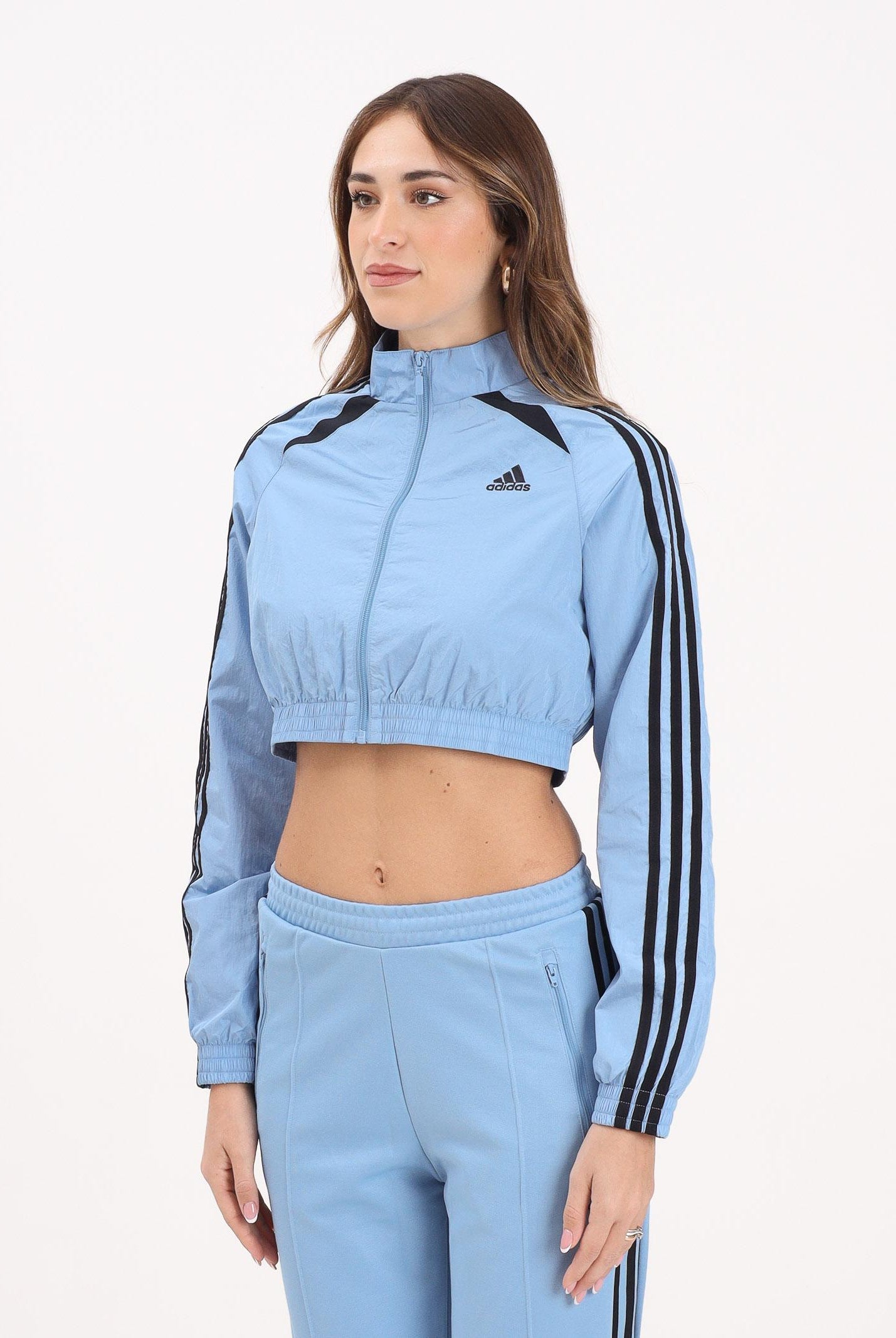 ADIDAS ORIGINALS Giacca a vento Teamgeist adicolor Cropped azzurra da donna JZ8277 . ADIDAS ORIGINALS
