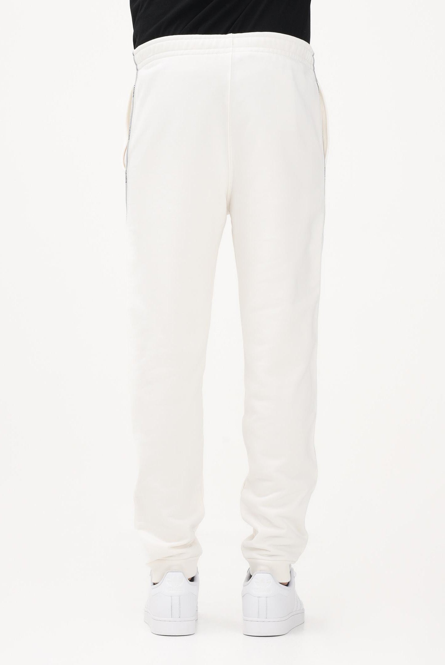 LACOSTE Pantalone sportivo bianco da uomo con rifiniture laterali logate XH0883 70V LACOSTE