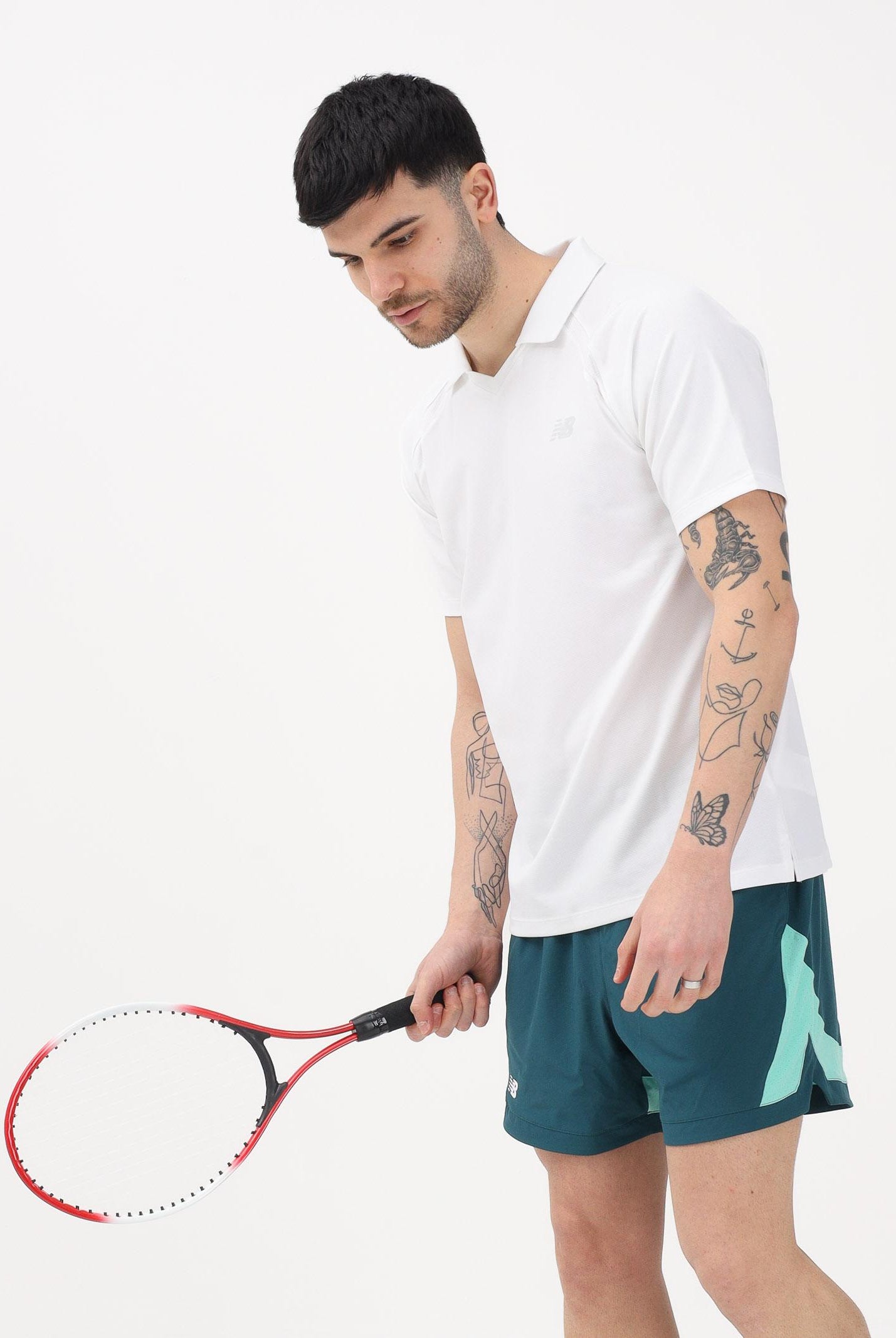 NEW BALANCE Polo a manica corta Tournament Dry bianca da uomo MT61W0HTWT . NEW BALANCE